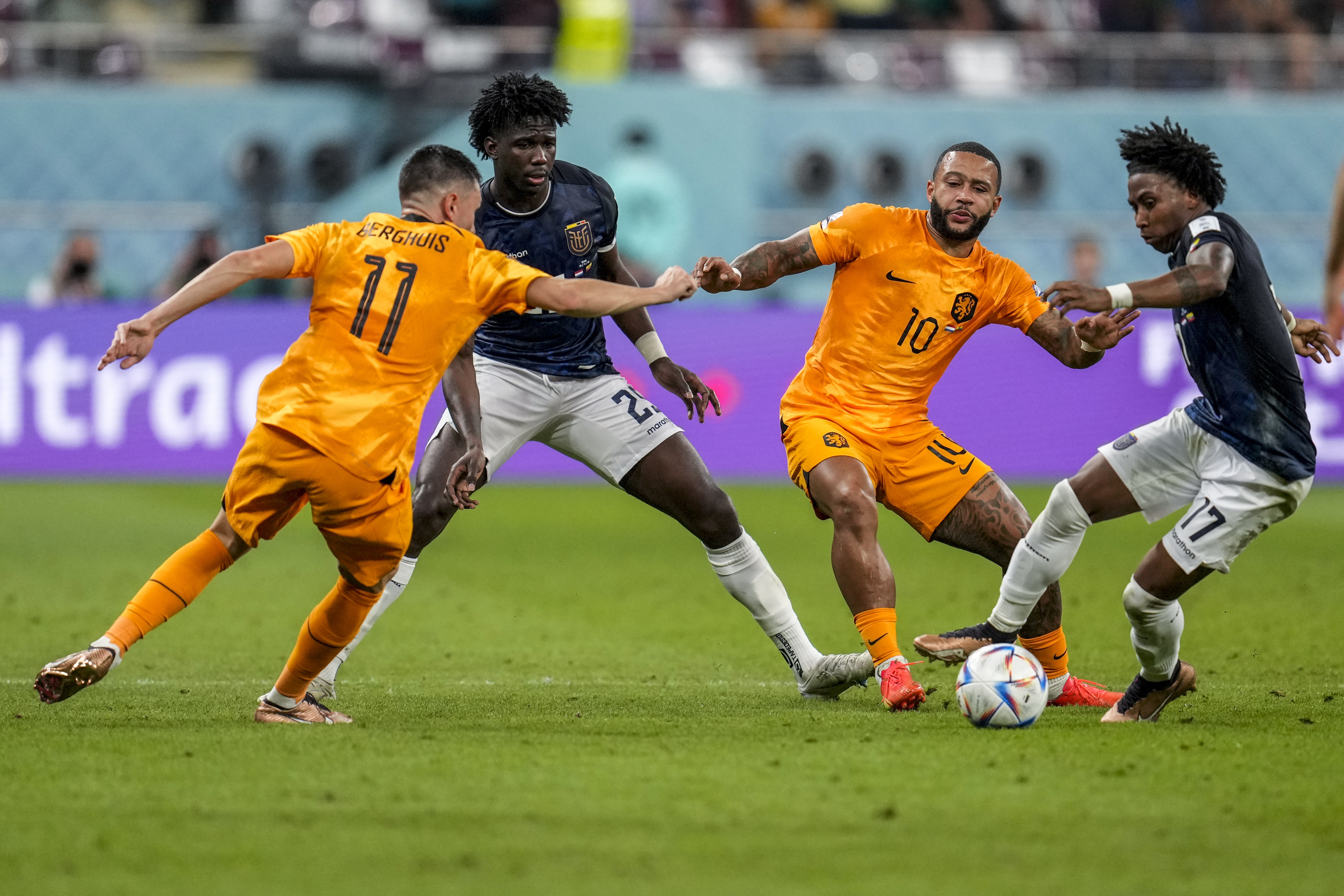Memphis Depay of the Netherlands, second right, vies for the ball with Ecuador's Angelo Preciado