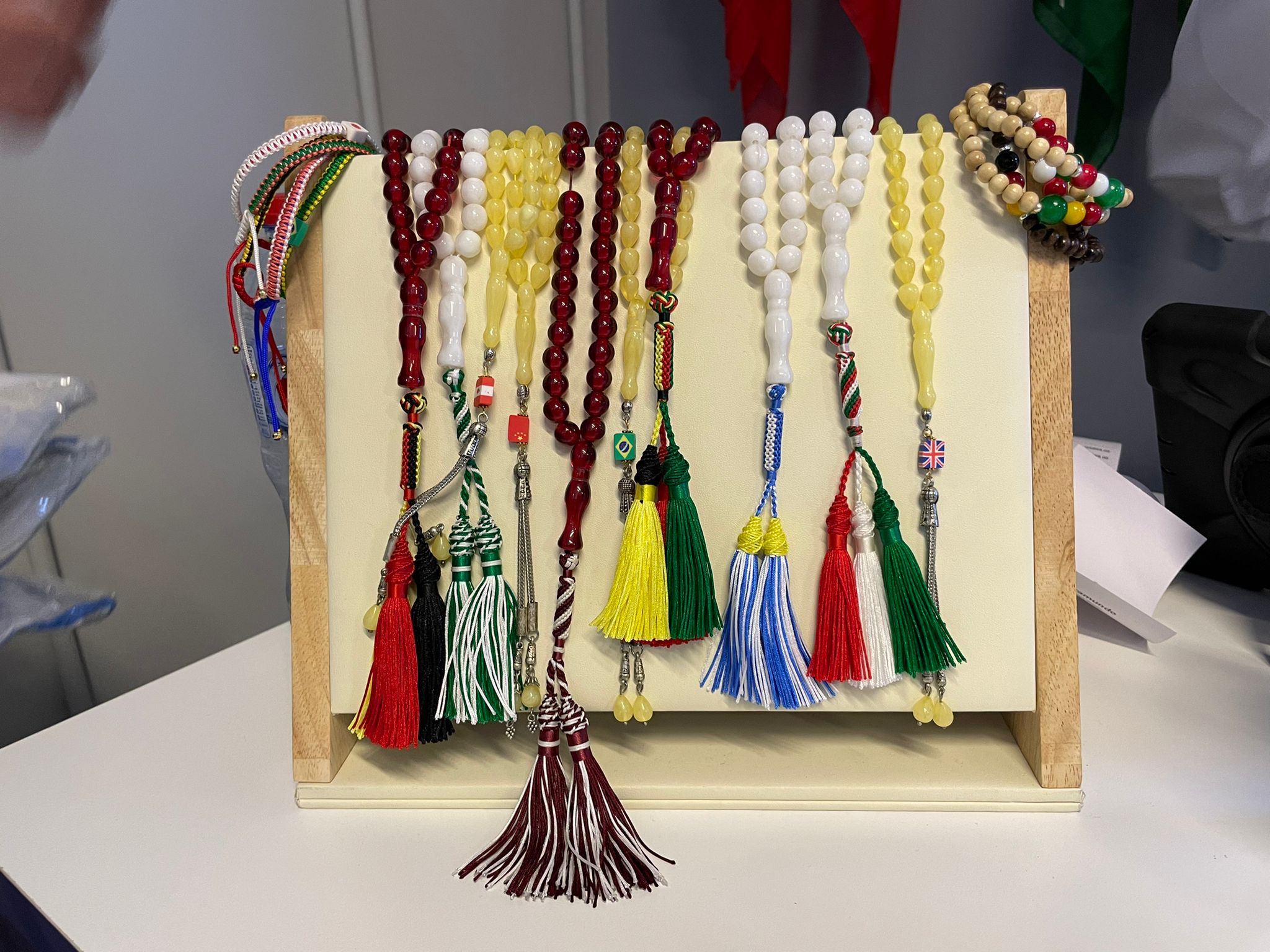 Prayer beads customised with the colours of some of the countries participating at the 2022 World Cup, on display at a Doha sports store