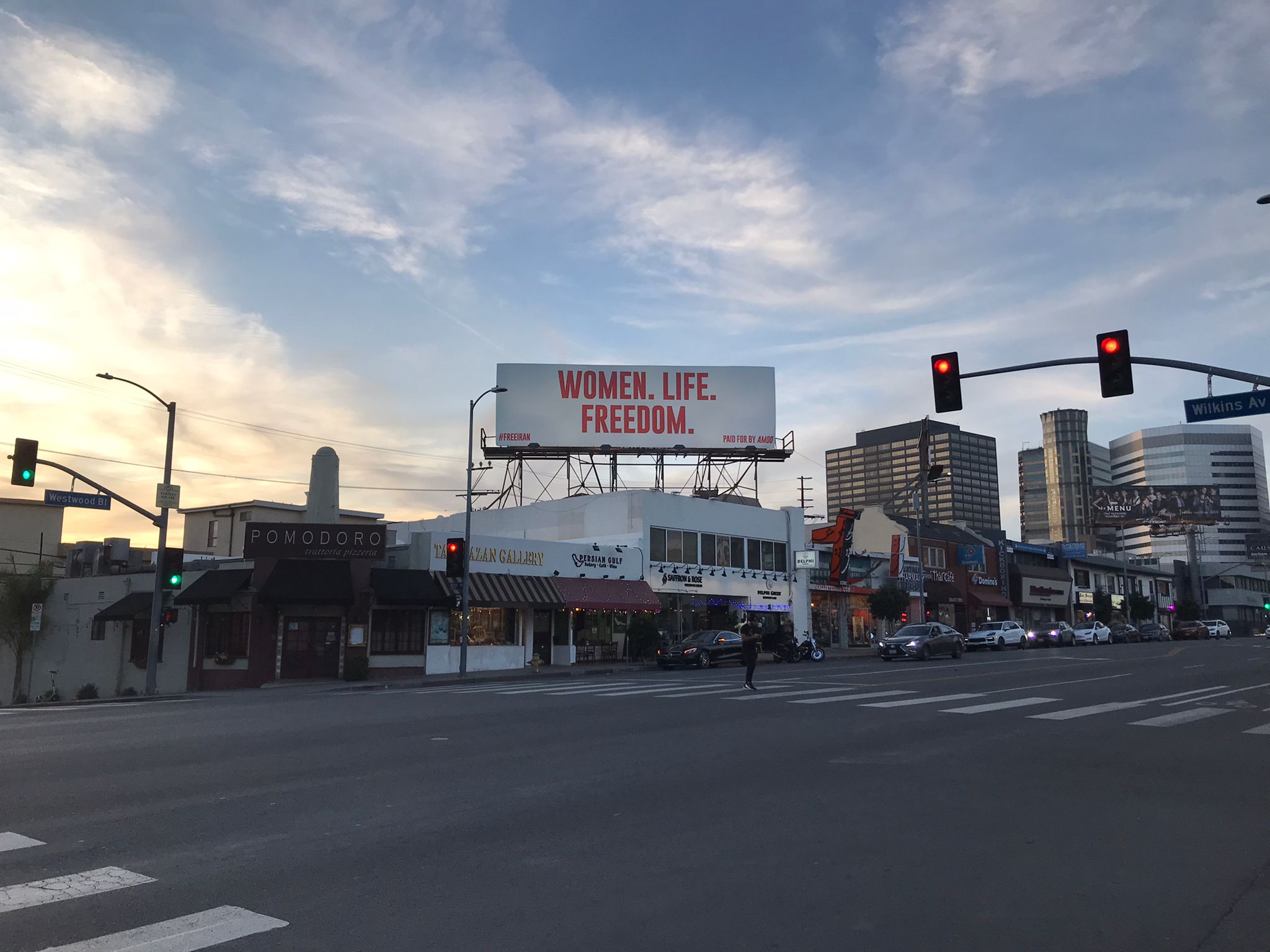A billboard with the words "Women, life, freedom" above Westwood Boulevard