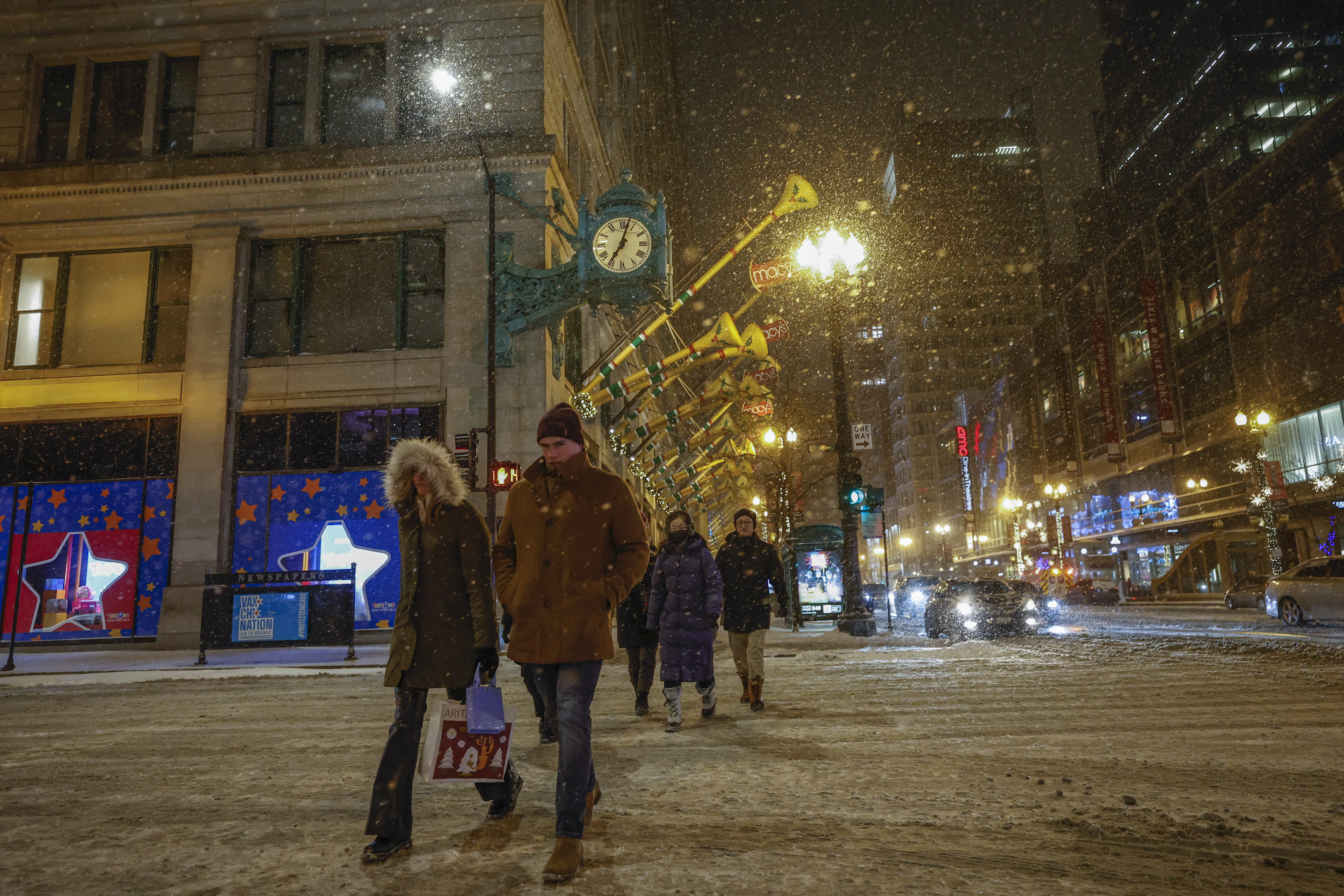 Pedestrians cross the street in Chicago