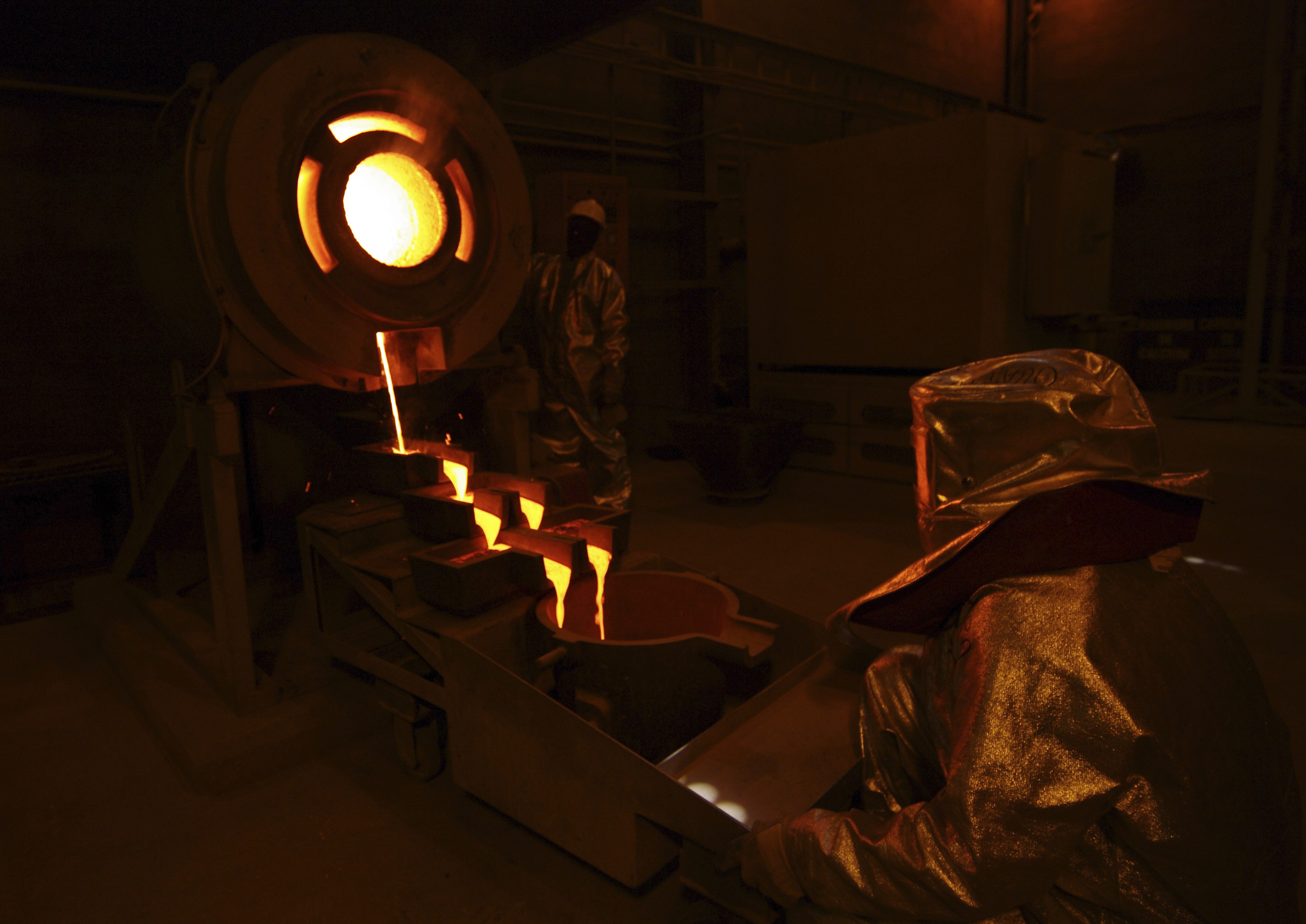 Gold pours from a crucible at the Taparko gold mine site in northern Burkina Faso