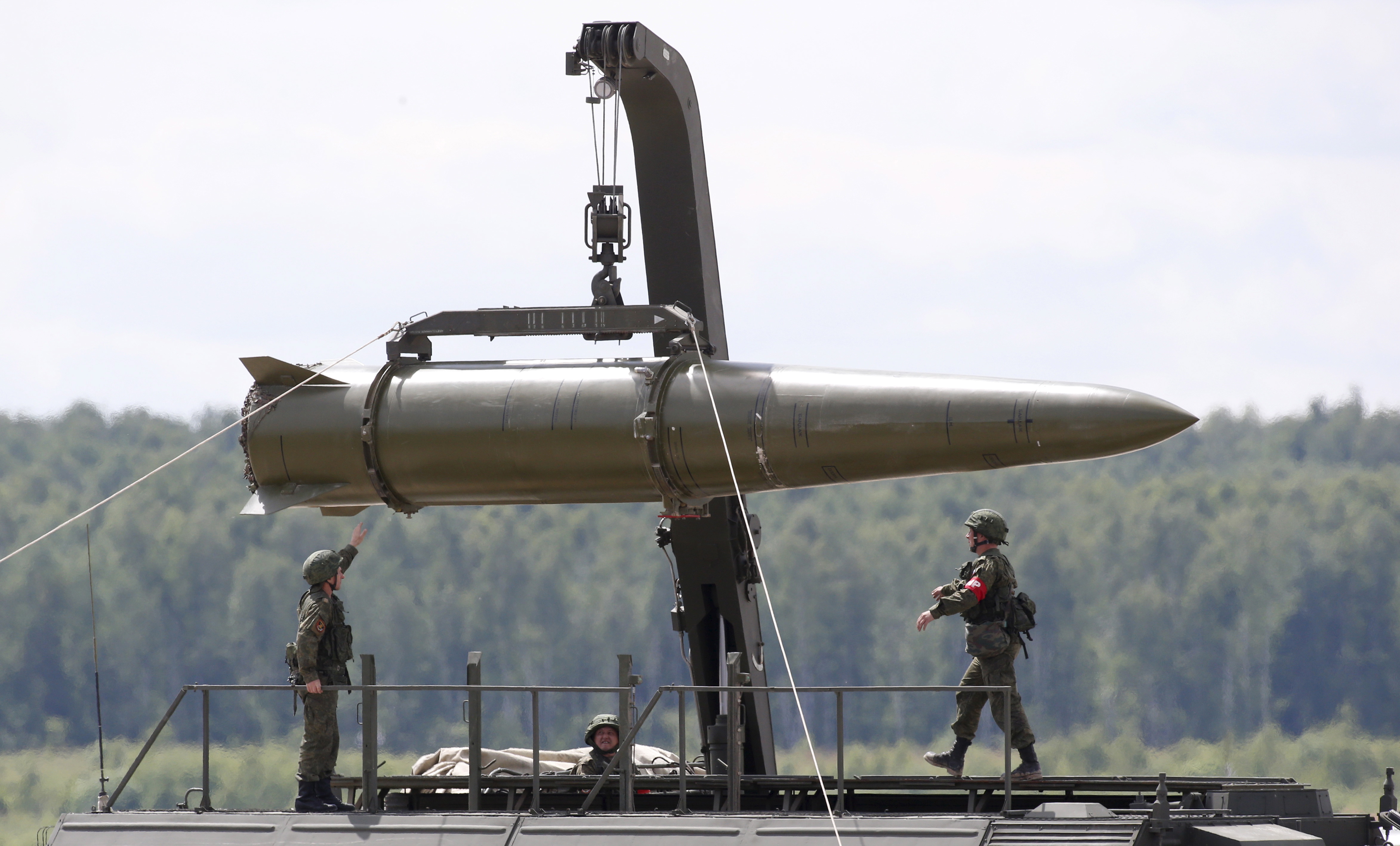 Russian service members equip an Iskander tactical missile system.