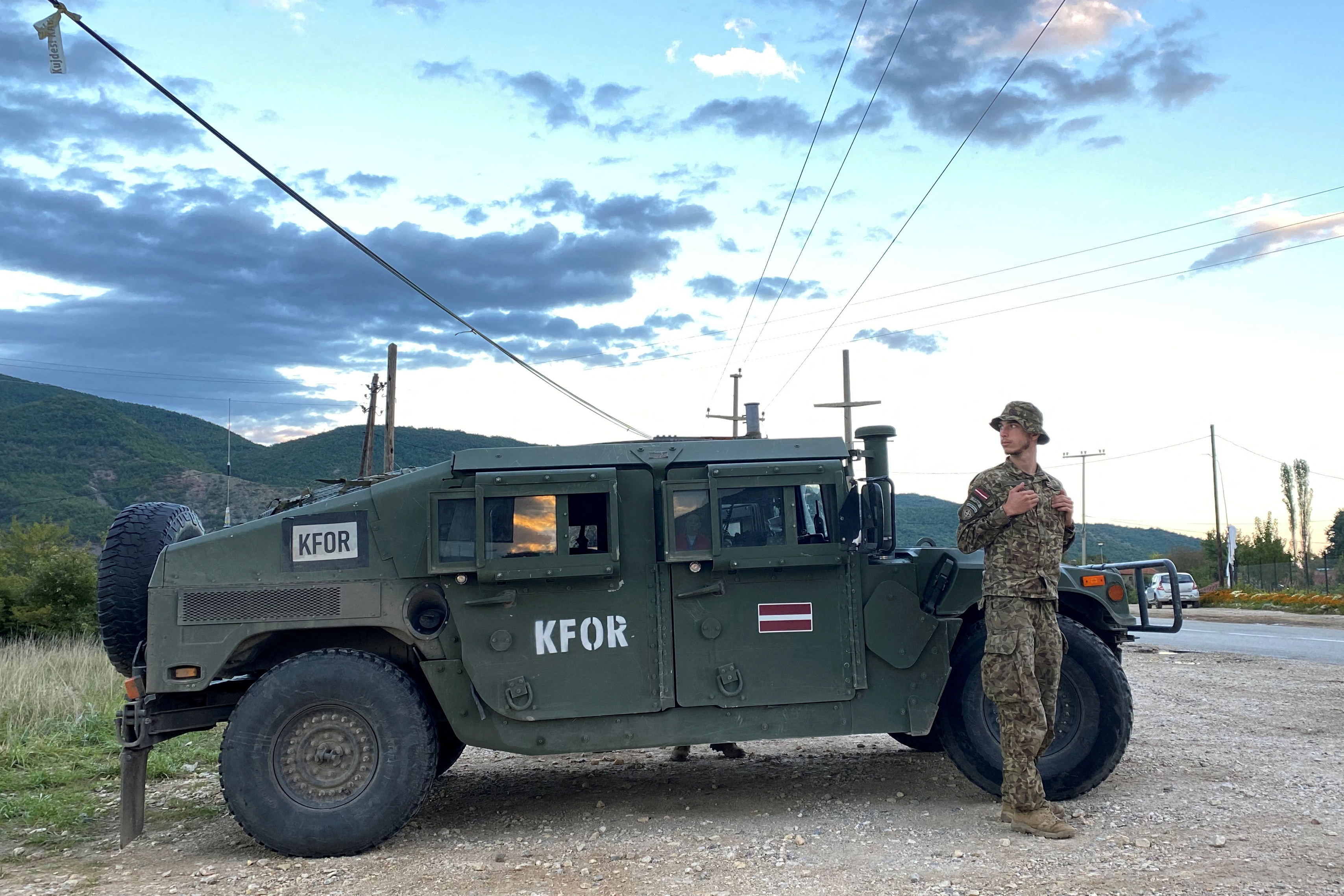 Latvian soldiers belonging to NATO's peacekeeping mission KFOR monitors a main road in Zubin Potok, Kosovo.
