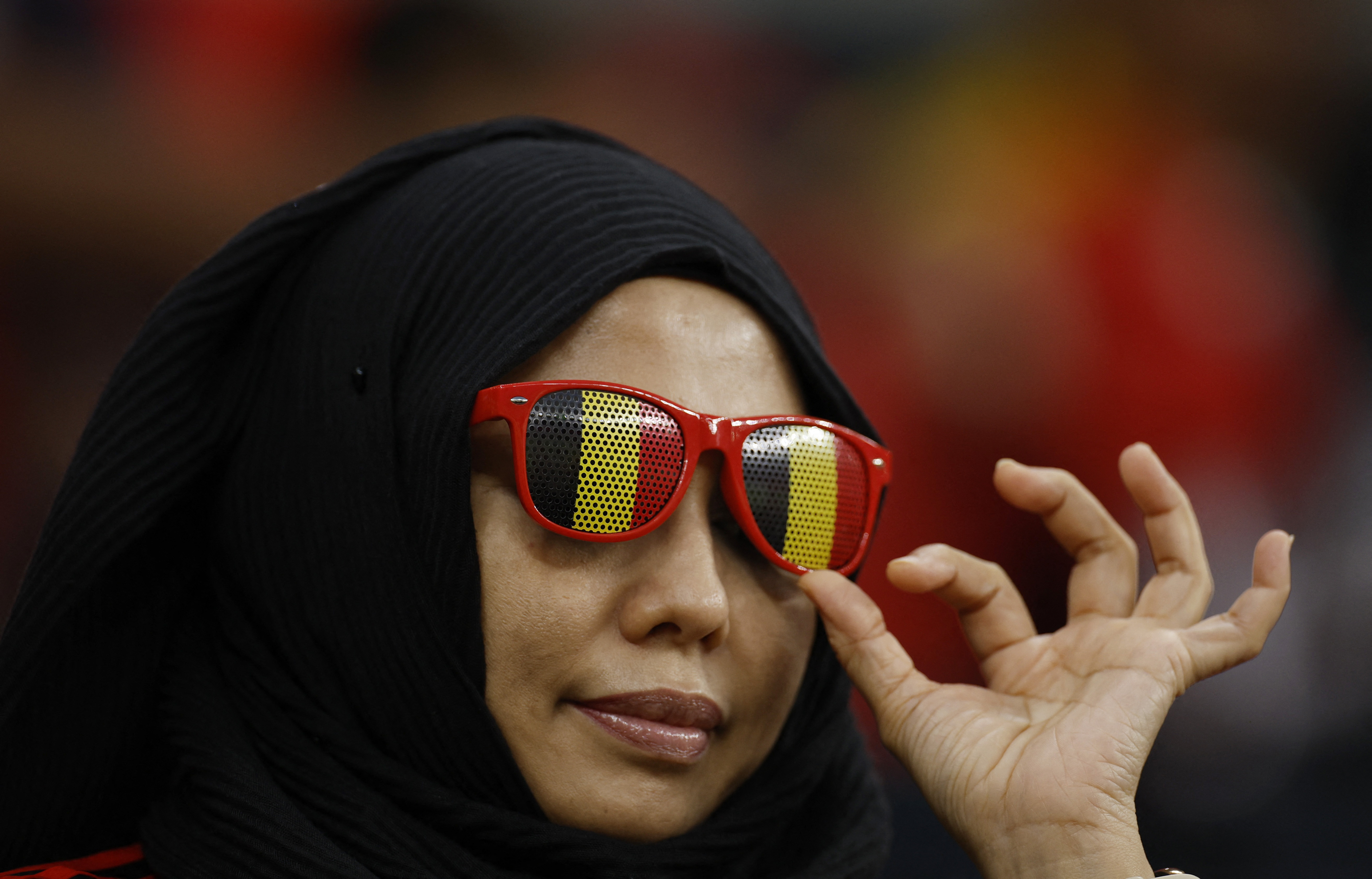 Belgium fan wearing sun glasses inside the stadium before the match