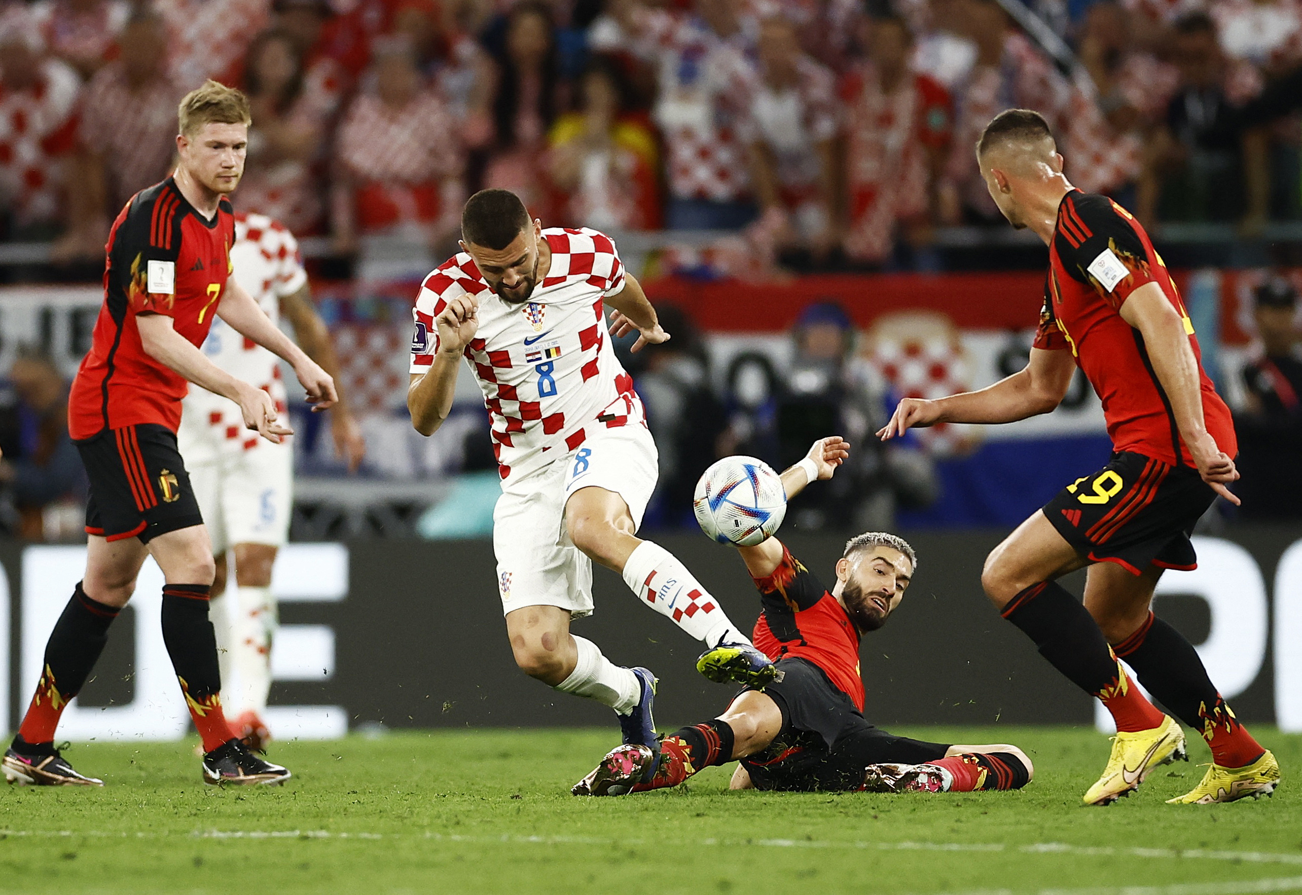 Croatia's Mateo Kovacic in action with Belgium's Yannick Carrasco