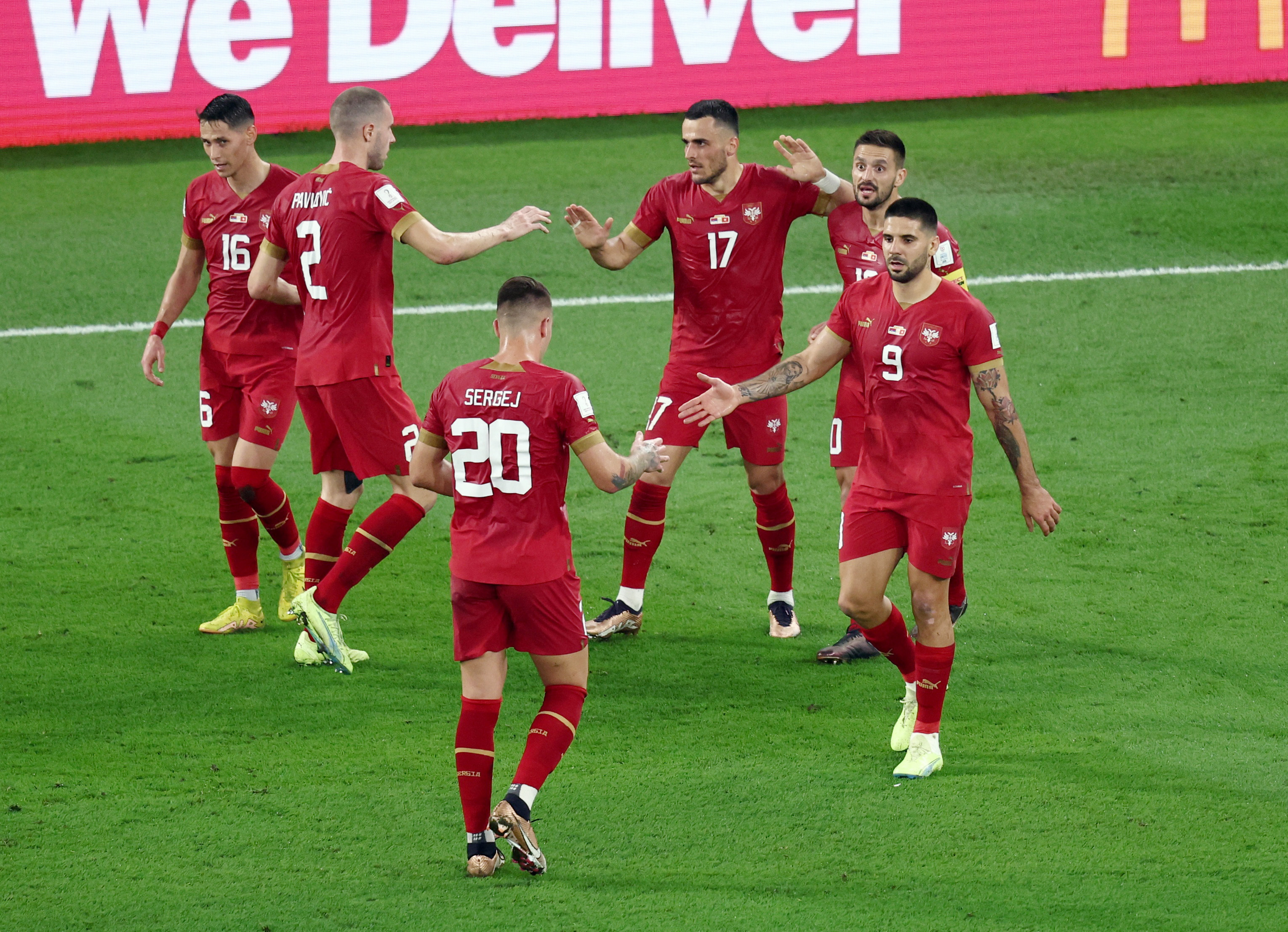 Soccer Football - FIFA World Cup Qatar 2022 - Group G - Serbia v Switzerland - Stadium 974, Doha, Qatar - December 2, 2022 Serbia's Aleksandar Mitrovic celebrates scoring their first goal with teammates REUTERS/Marko Djurica