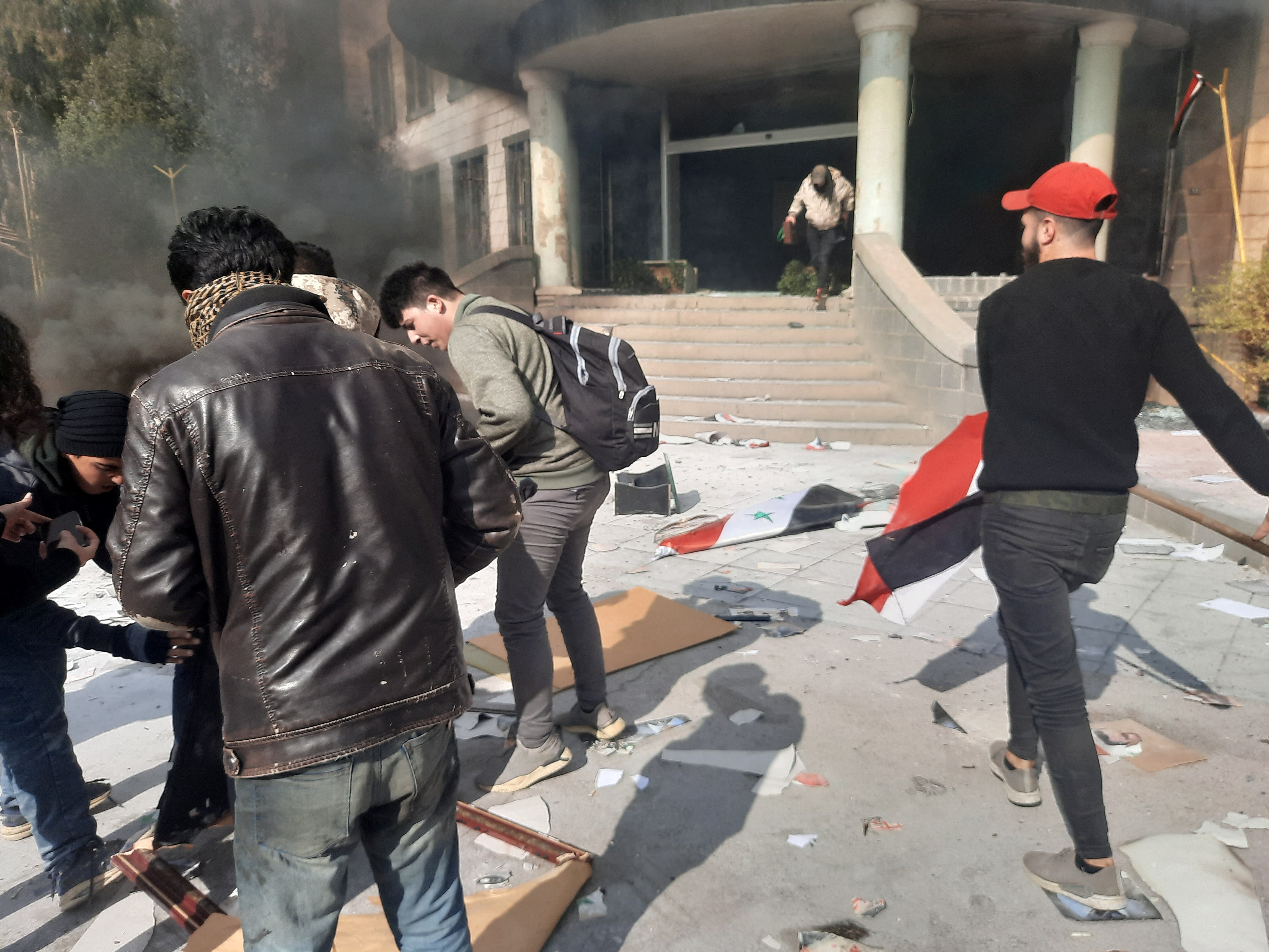 People gather as they take part in a protest in Sweida, Syria.