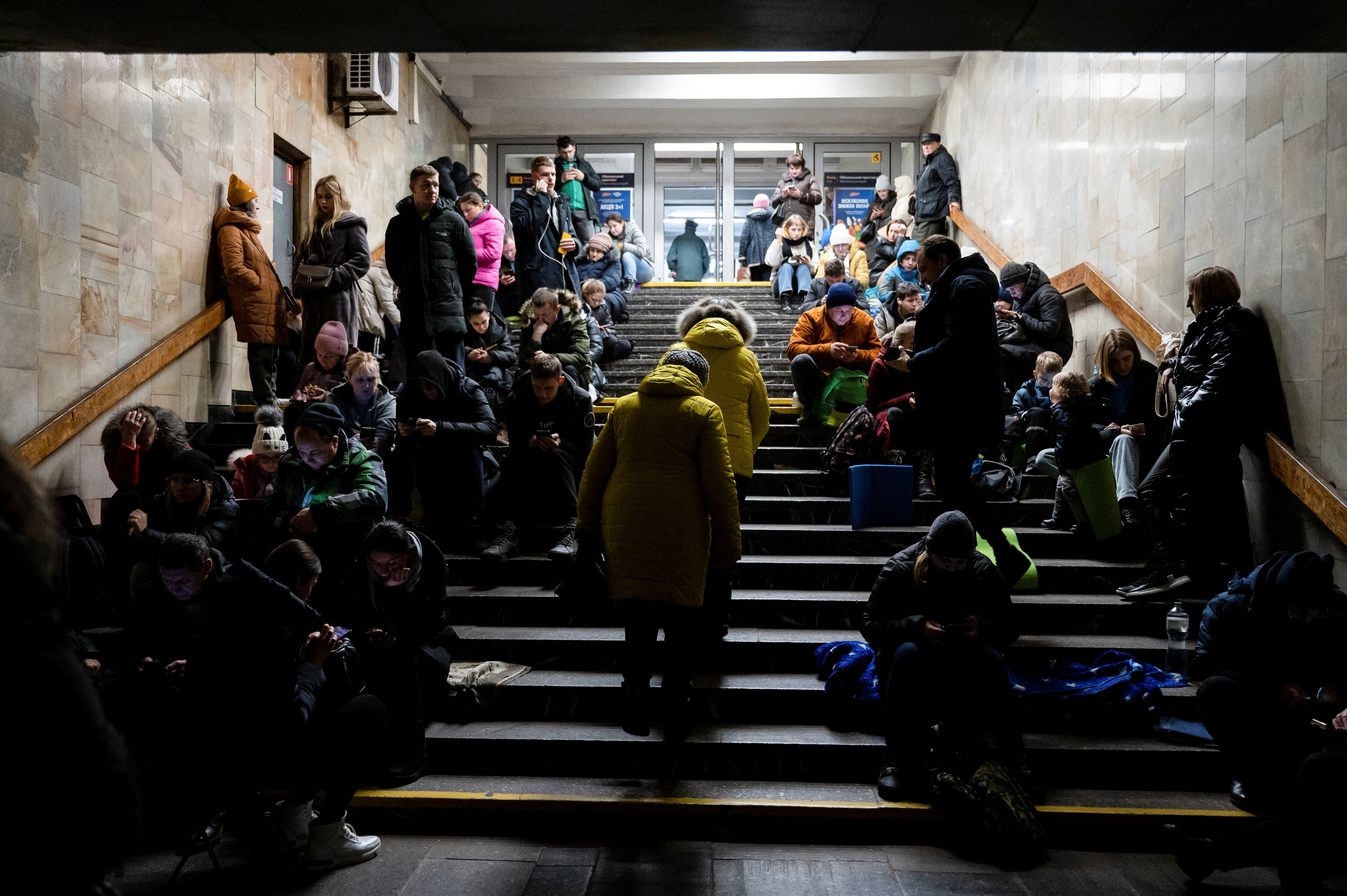 People take shelter inside a metro station during massive Russian missile attacks in Kyiv, Ukraine, December 29, 2022
