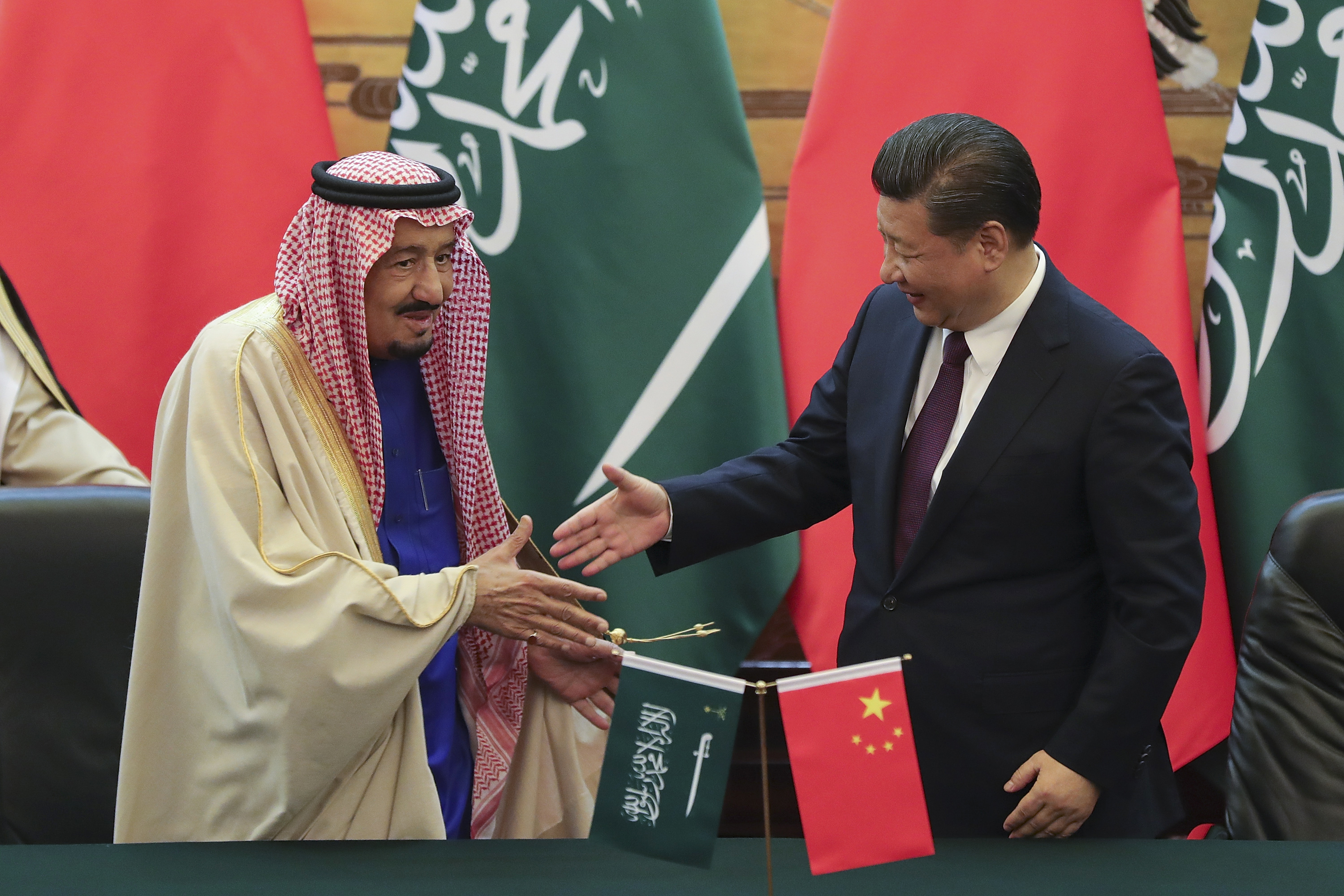 Chinese President Xi Jinping, right, shakes hands with Saudi King Salman during a signing ceremony at the Great Hall of the People in Beijing, China, Thursday, March 16, 2017. (Lintao Zhang/Pool Photo via AP)