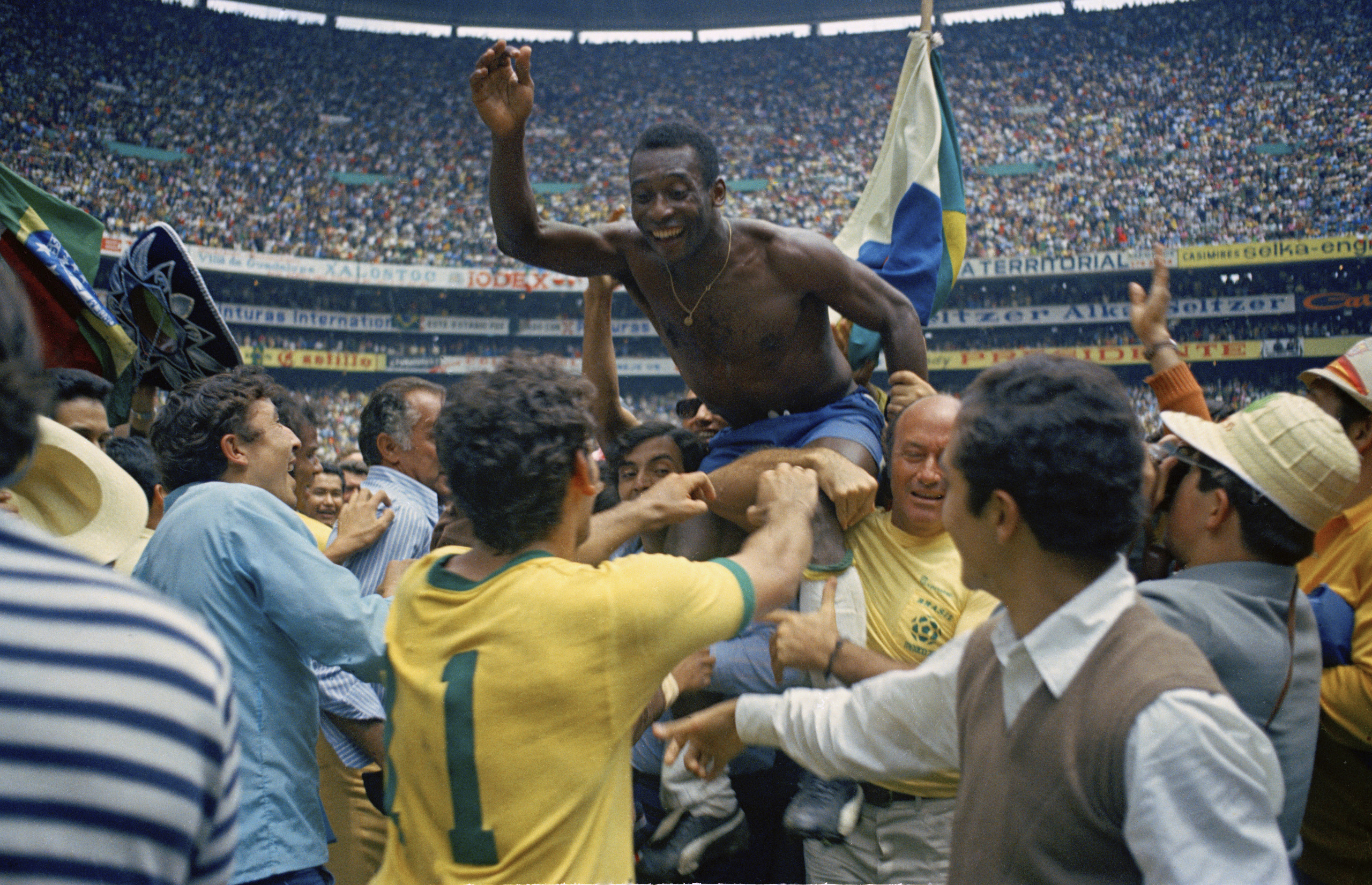Teammates hoist Pele, centre, on their shoulders after Brazil won the World Cup, defeating Italy 4-1, in Mexico City on June 21, 1970 [AP Photo]