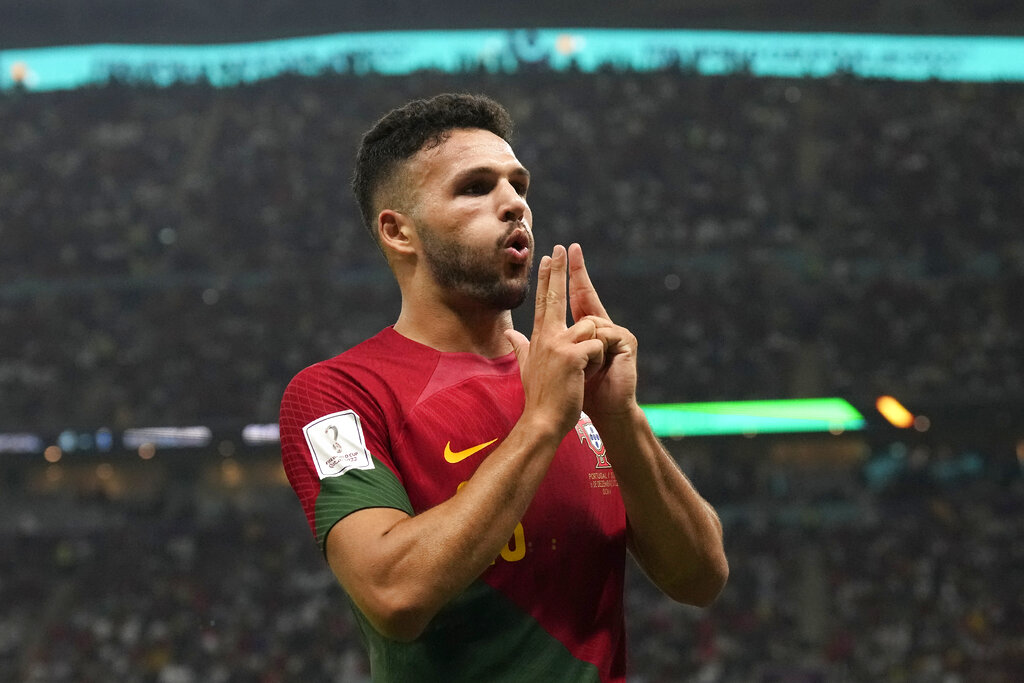Portugal's Goncalo Ramos celebrates after scoring a goal during the World Cup round of 16 soccer match between Portugal and Switzerland, at the Lusail Stadium in Lusail, Qatar, on December 6, 2022 [Natacha Pisarenko/AP Photo] 