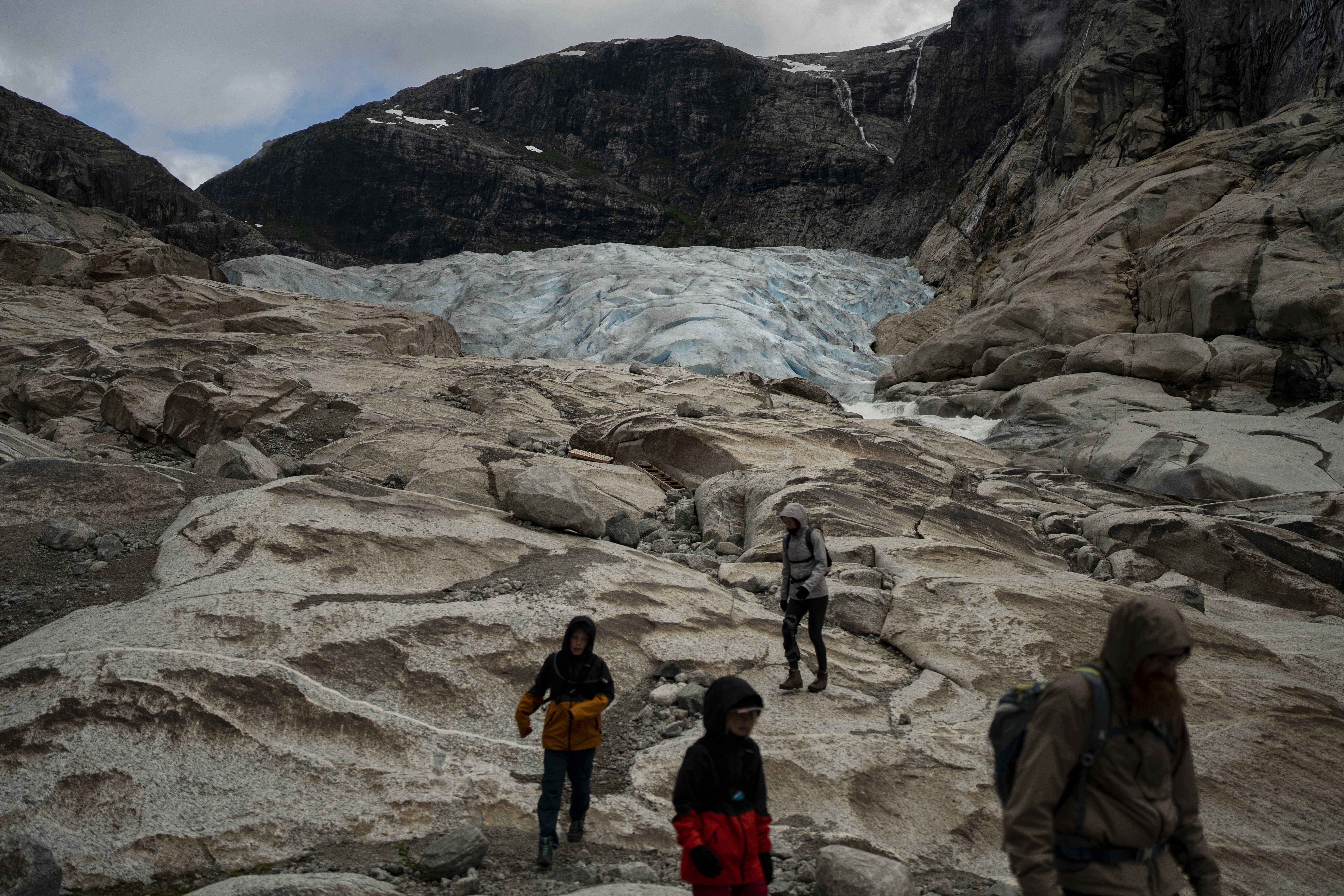 Tourists hike to visit the Nigardsbreen glacier