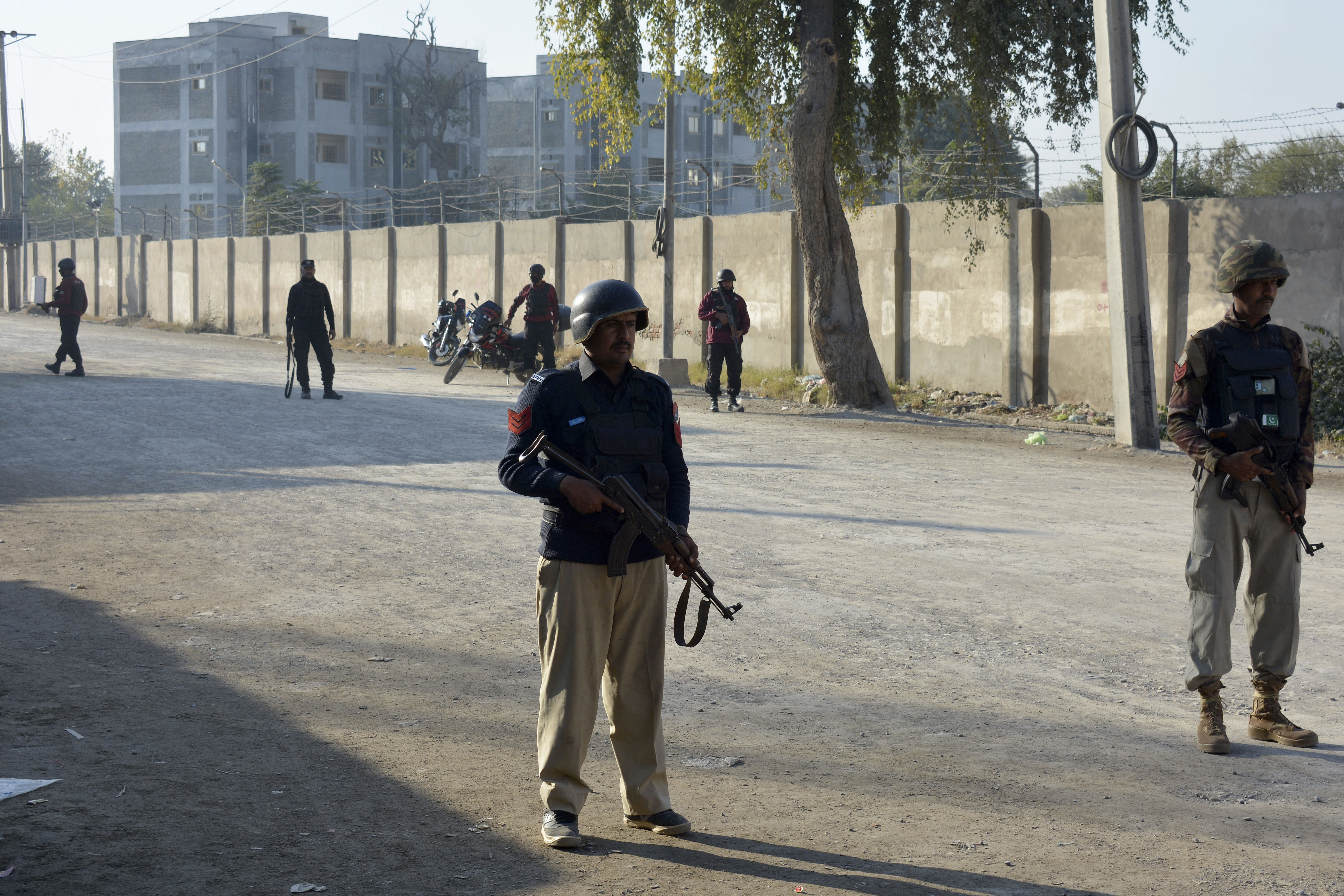 Security officials guard a blocked road leading to a counter-terrorism center