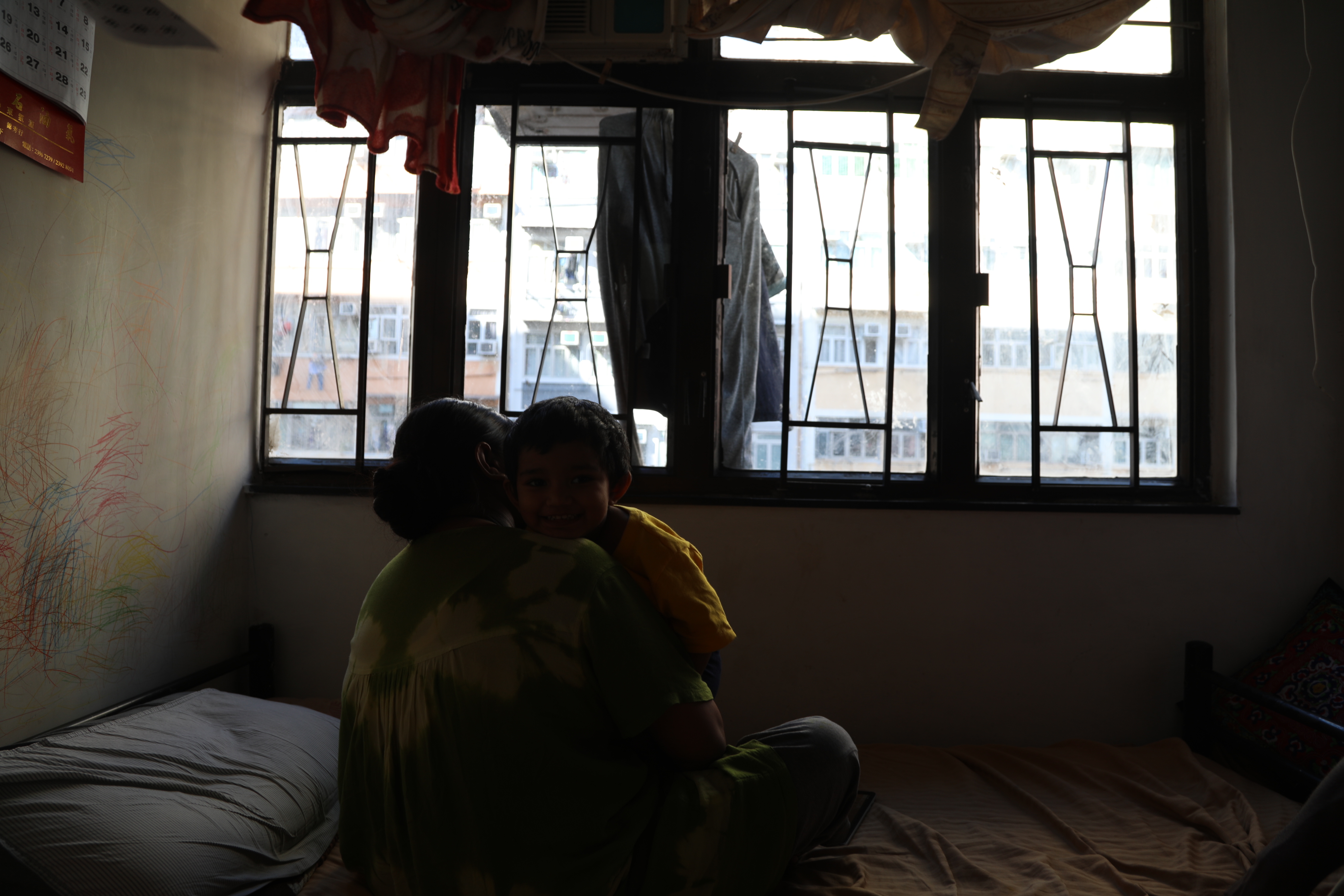 A mother and son in a room