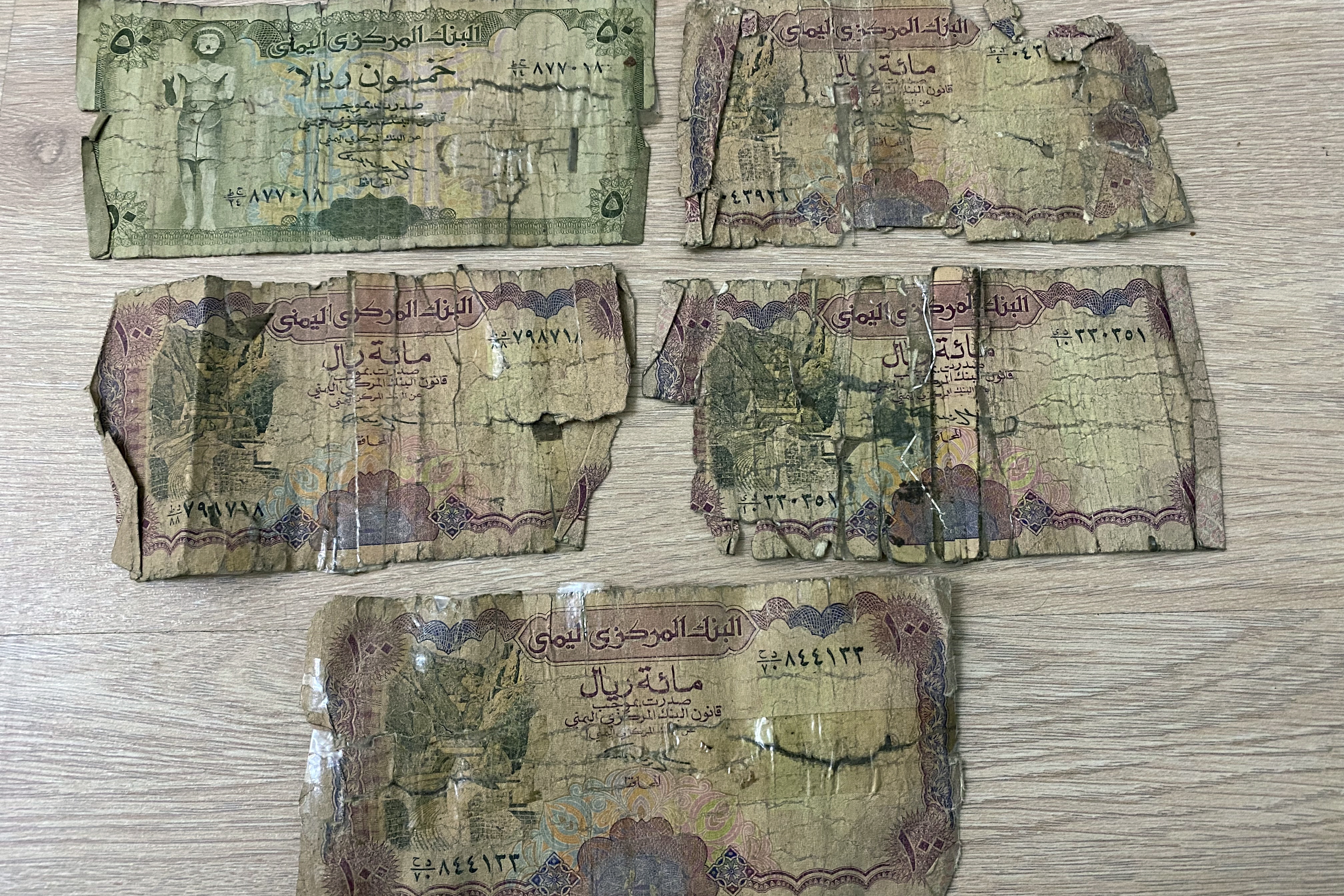Tattered Yemeni bank notes
