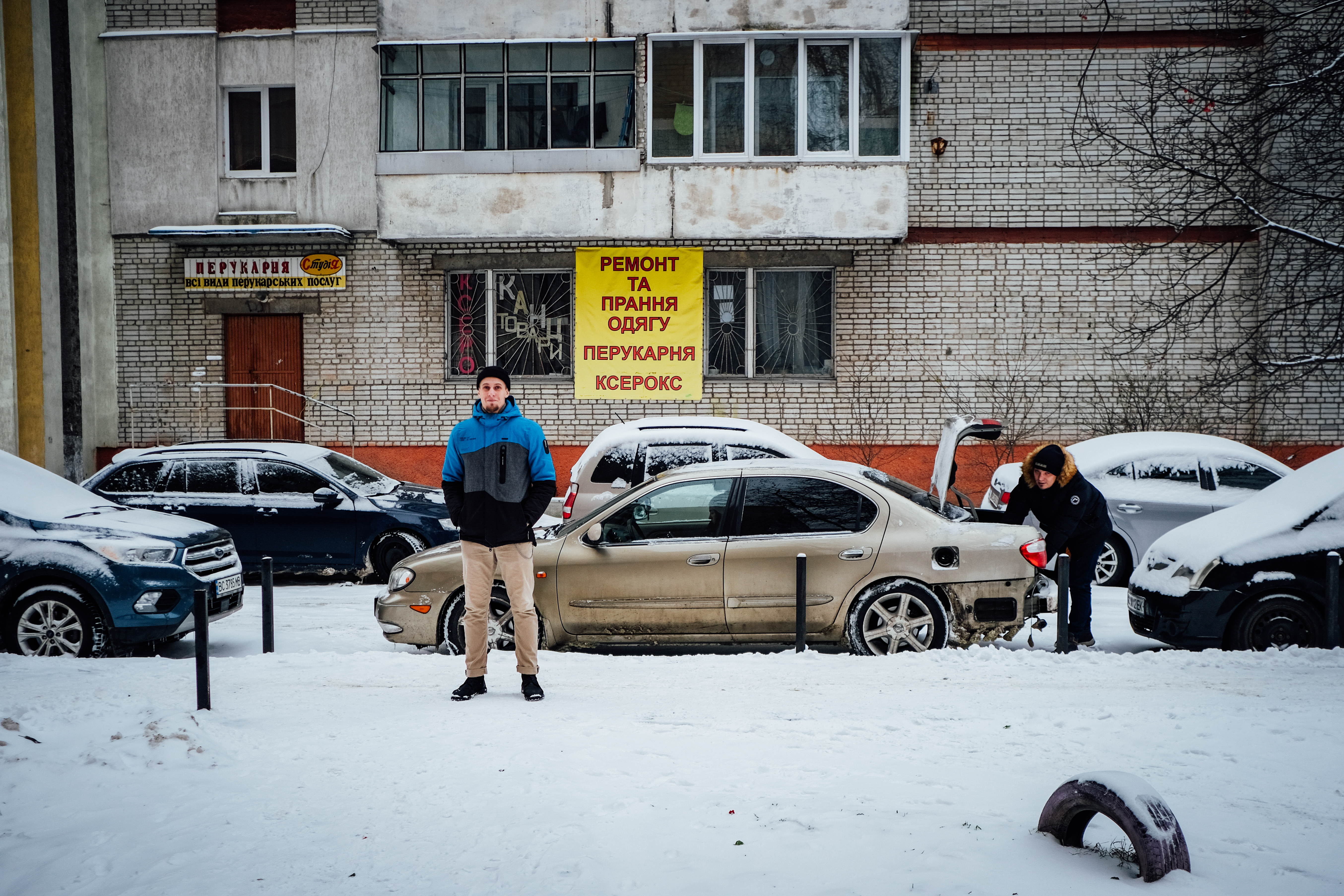 Oleksandr near gym: Oleksandr stands in near his home, which is also close to his Brazilian Ji Jitsu gym. He says that Iryna and him are fortunate that their district has not been as badly hit by electricity blackouts as neighbouring districts 