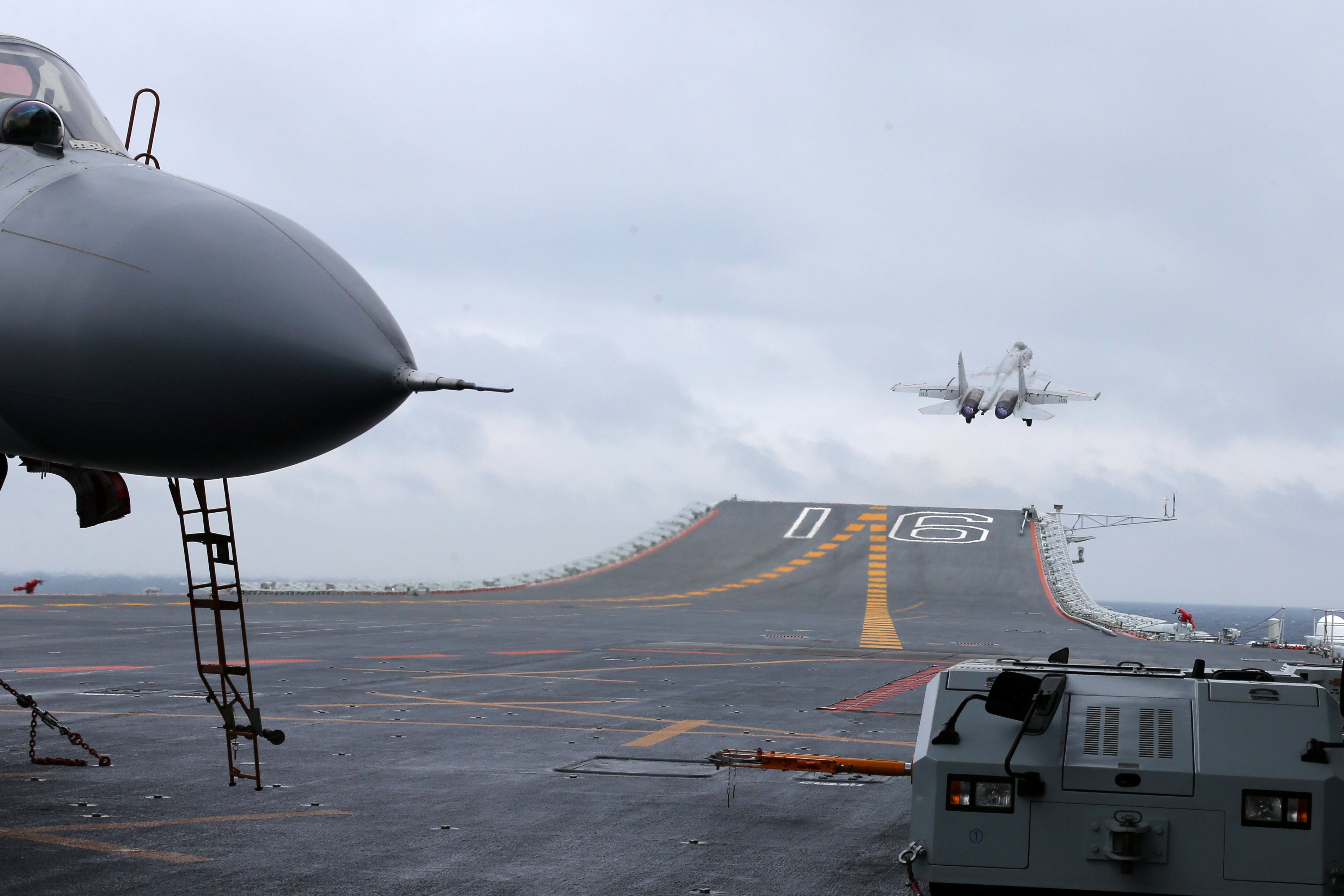 A J-15 fighter takes off from China's Liaoning aircraft carrier to conduct a drill in an area of the South China Sea.