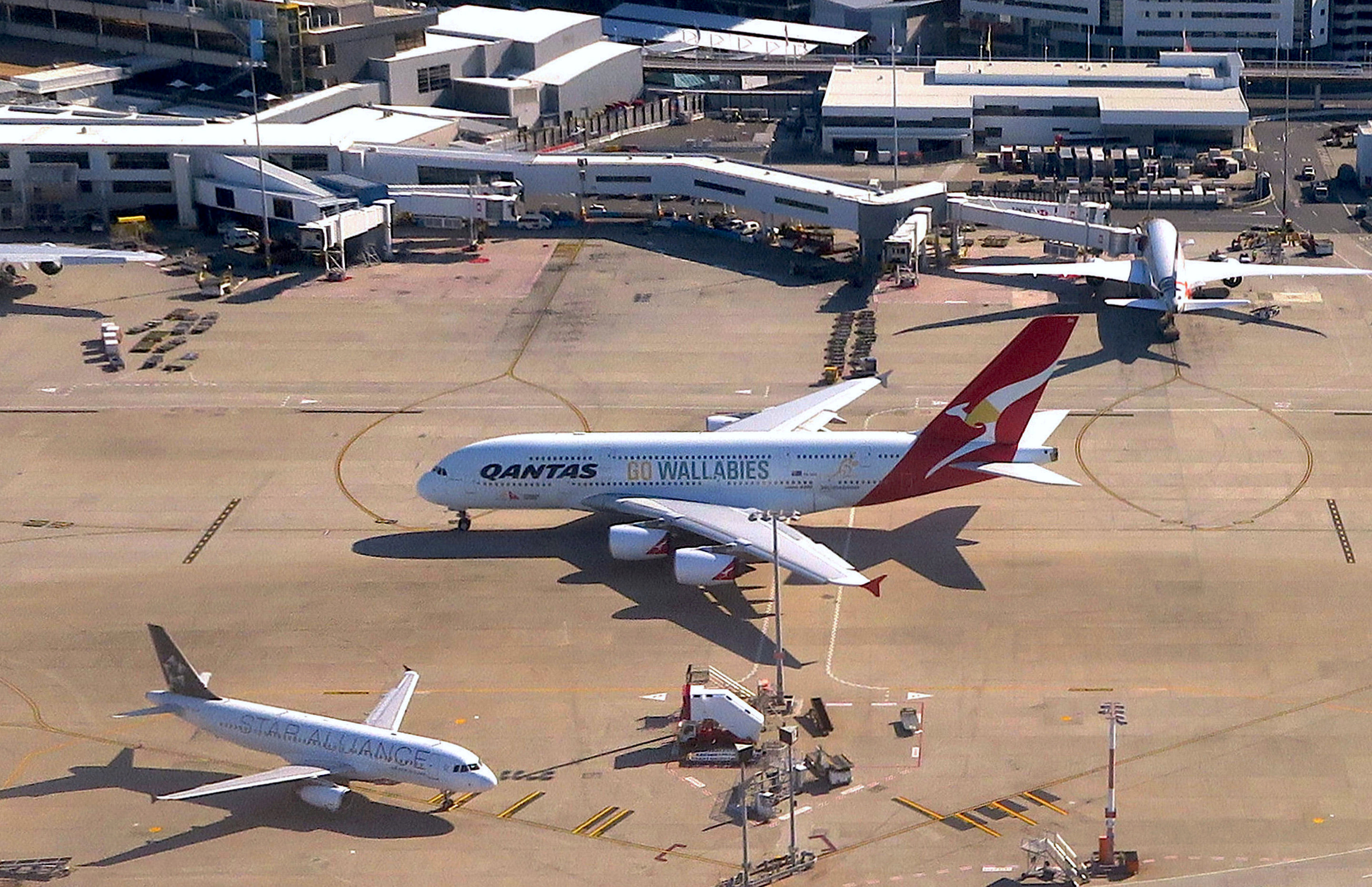 A Qantas Airlines Airbus A380 moves along the tarmac towards the terminal at Sydney's International Airport in Australia.