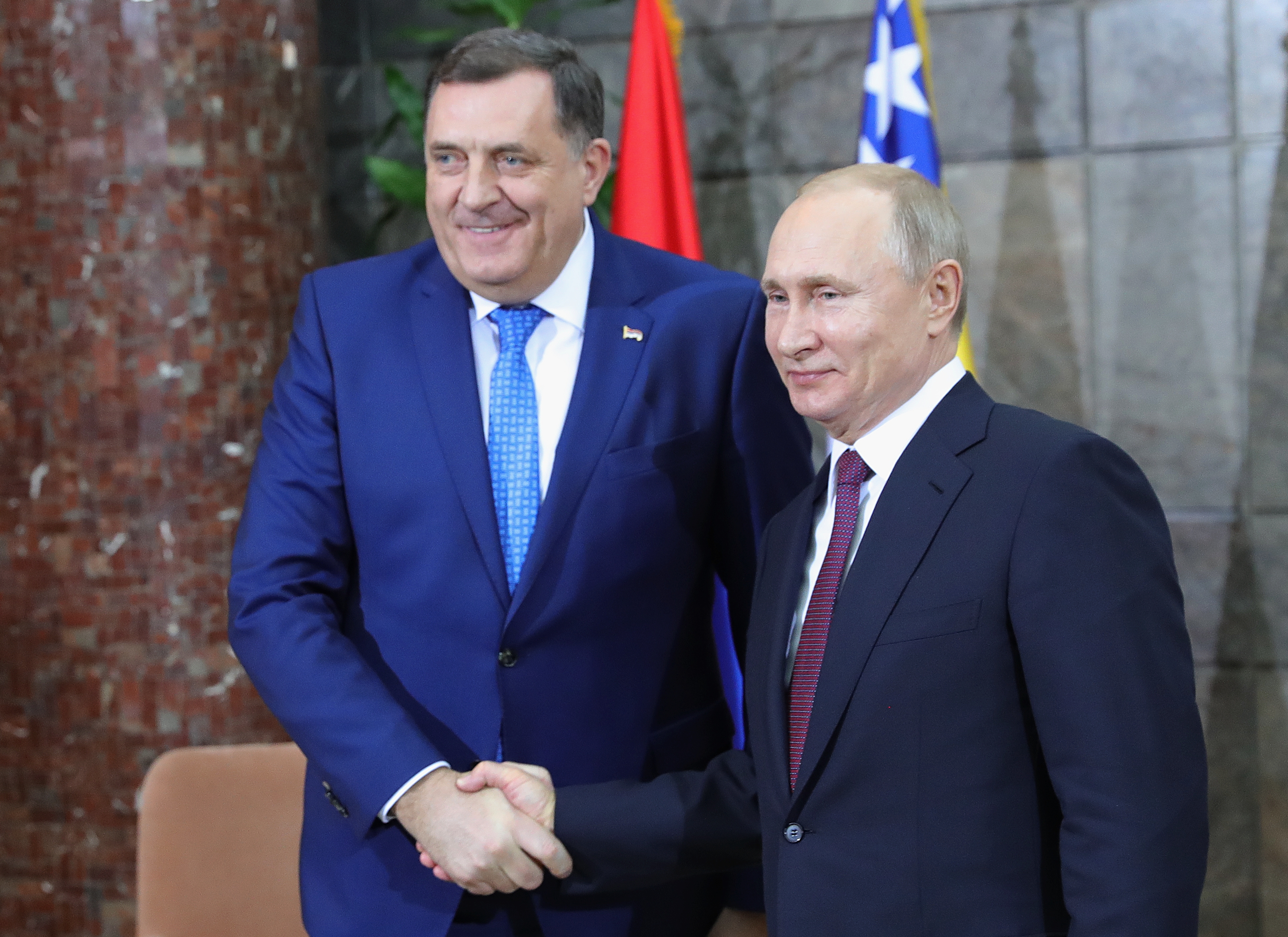 Russian President Vladimir Putin shakes hands with Serb member of Bosnia's tripartite inter-ethnic presidency Milorad Dodik in Belgrade, Serbia January 17, 2019