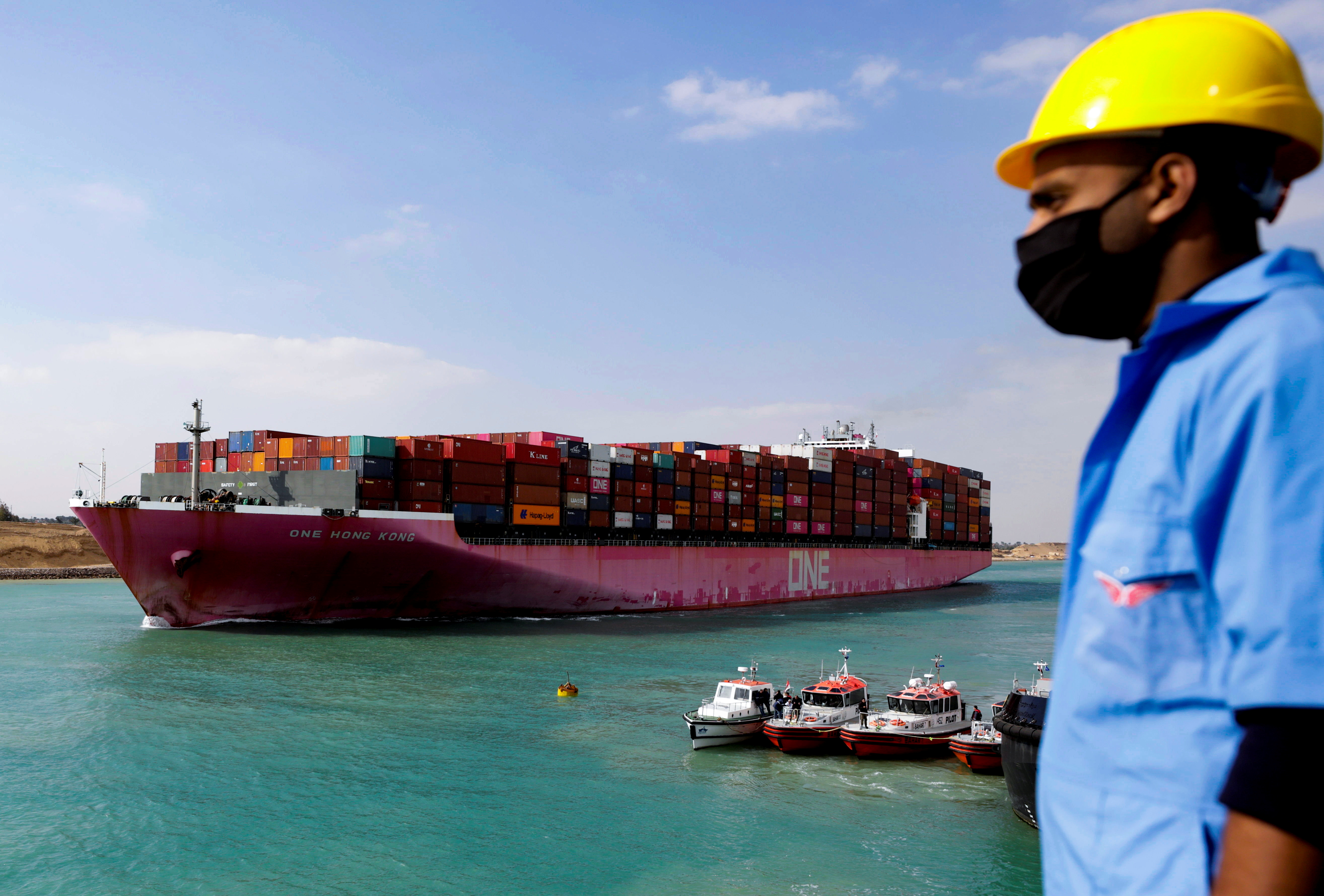 Shipping containers are seen on a ship, belonging to Ocean Network Express (ONE), moving through the Suez Canal in Suez, Egypt February 15, 2022. Picture taken February 15, 2022