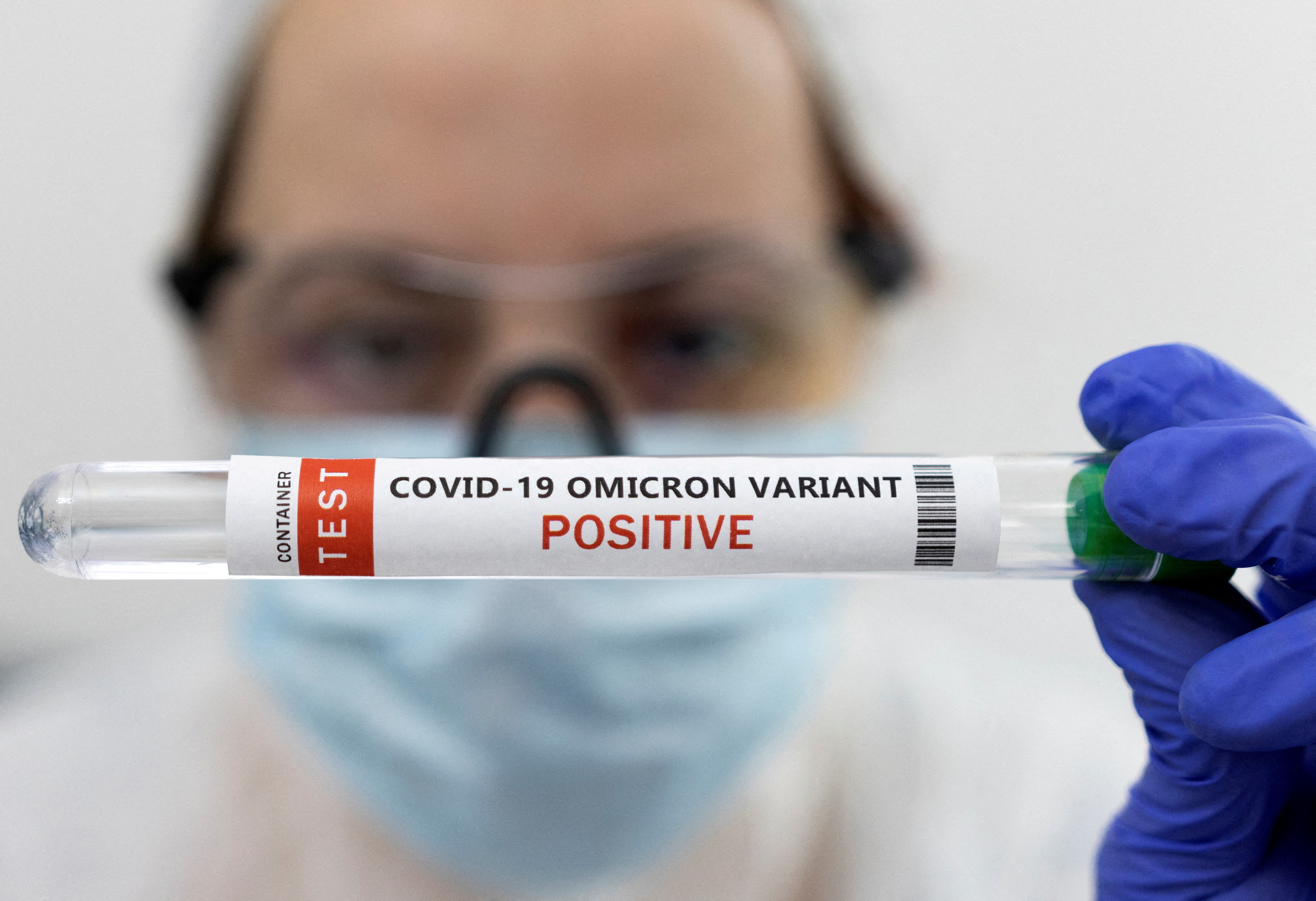 Test tube labelled "COVID-19 Omicron variant test positive" is seen in this illustration picture taken January 15, 2022