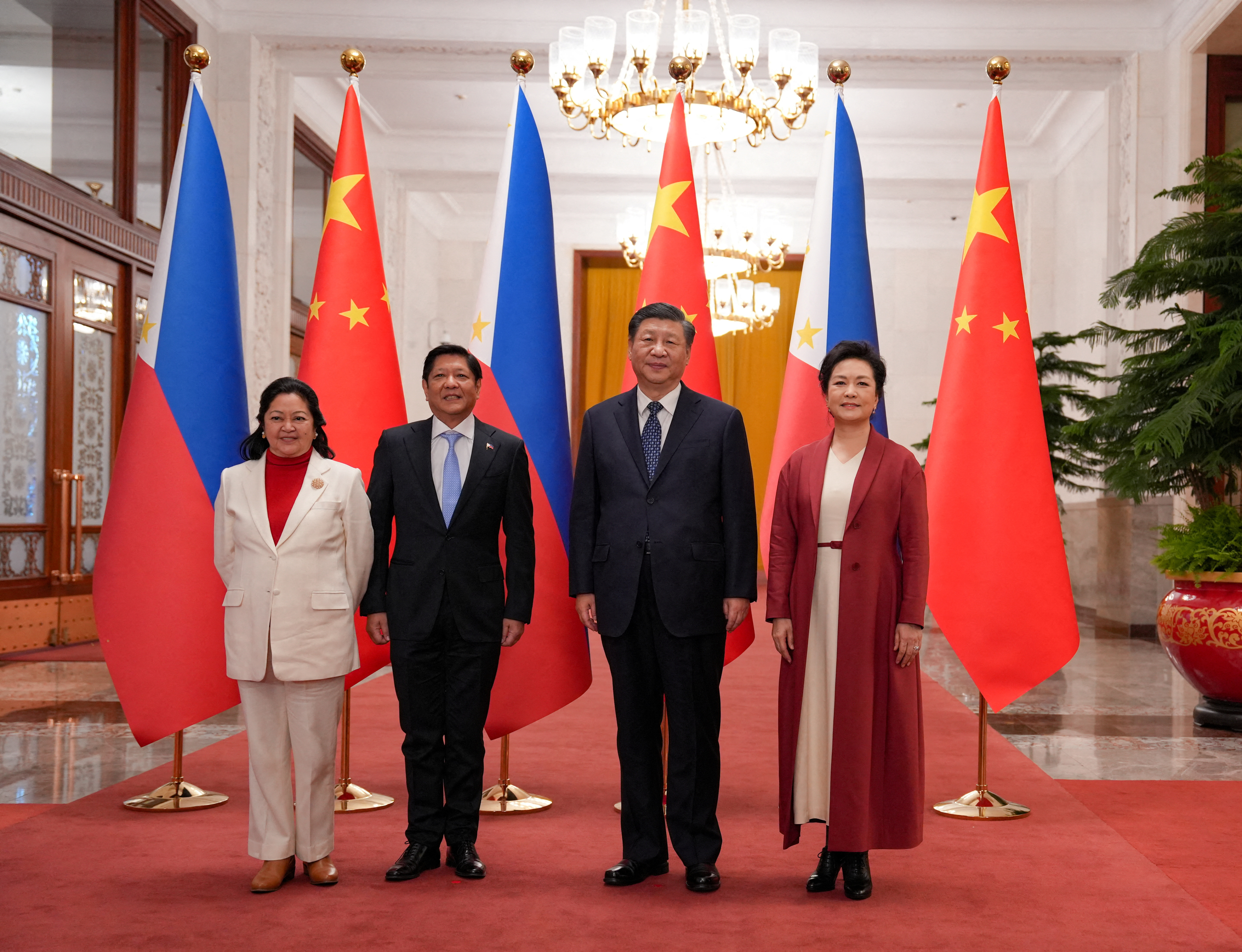 Philippines' President Ferdinand "Bongbong" Marcos Jr. and First Lady Liza Araneta Marcos are photographed with China President Xi Jinping and his wife Peng Li Yuan during a welcoming ceremony at the Great Hall of the People in Beijing