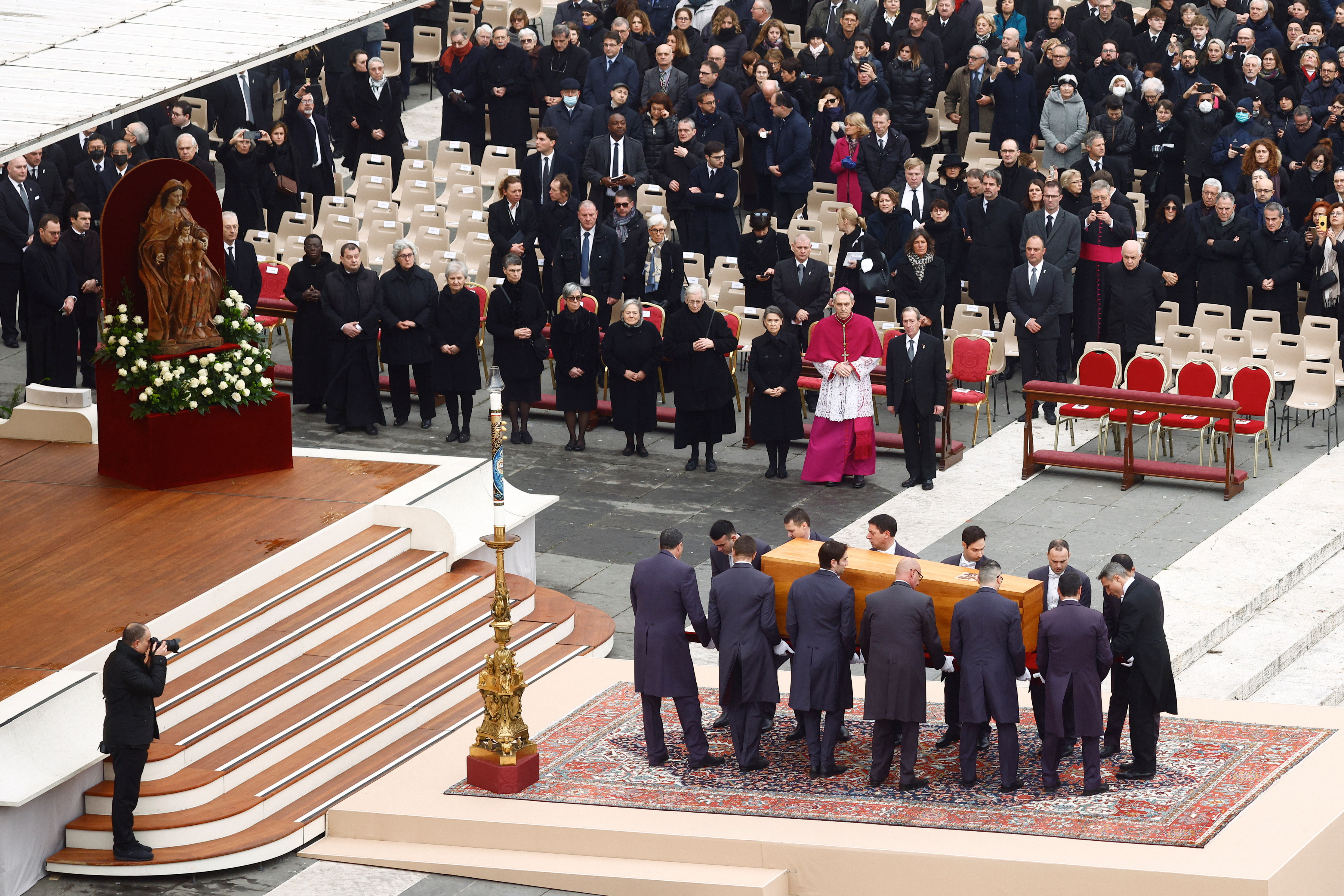 The coffin of former Pope Benedict is carried during his funeral, in St. Peter's Square at the Vatican, January 5, 2023. REUTERS/Guglielmo Mangiapa