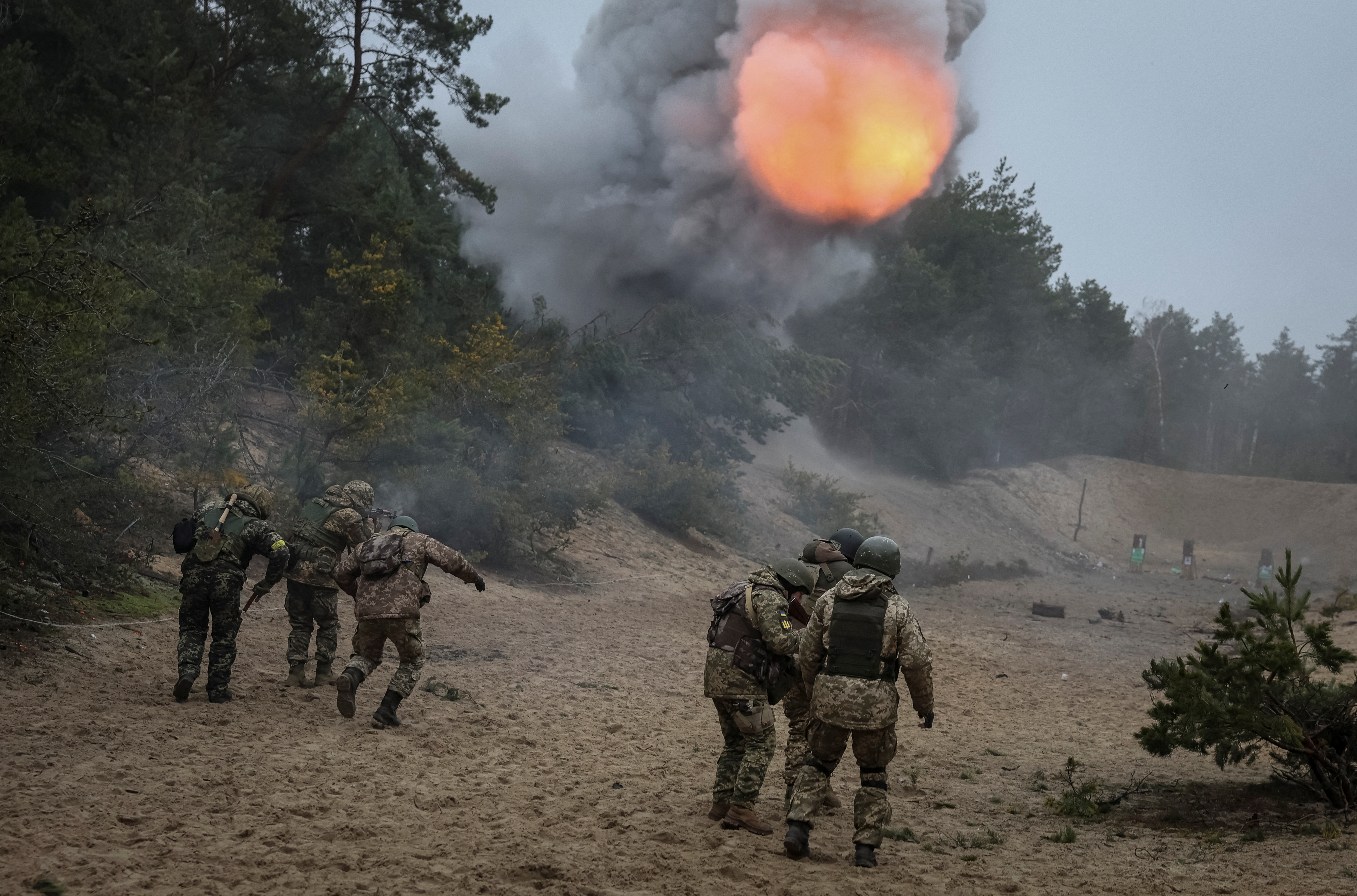 Ukrainian servicemen from the Volyn Territorial Defence brigade attend an exercise near the border with Belarus