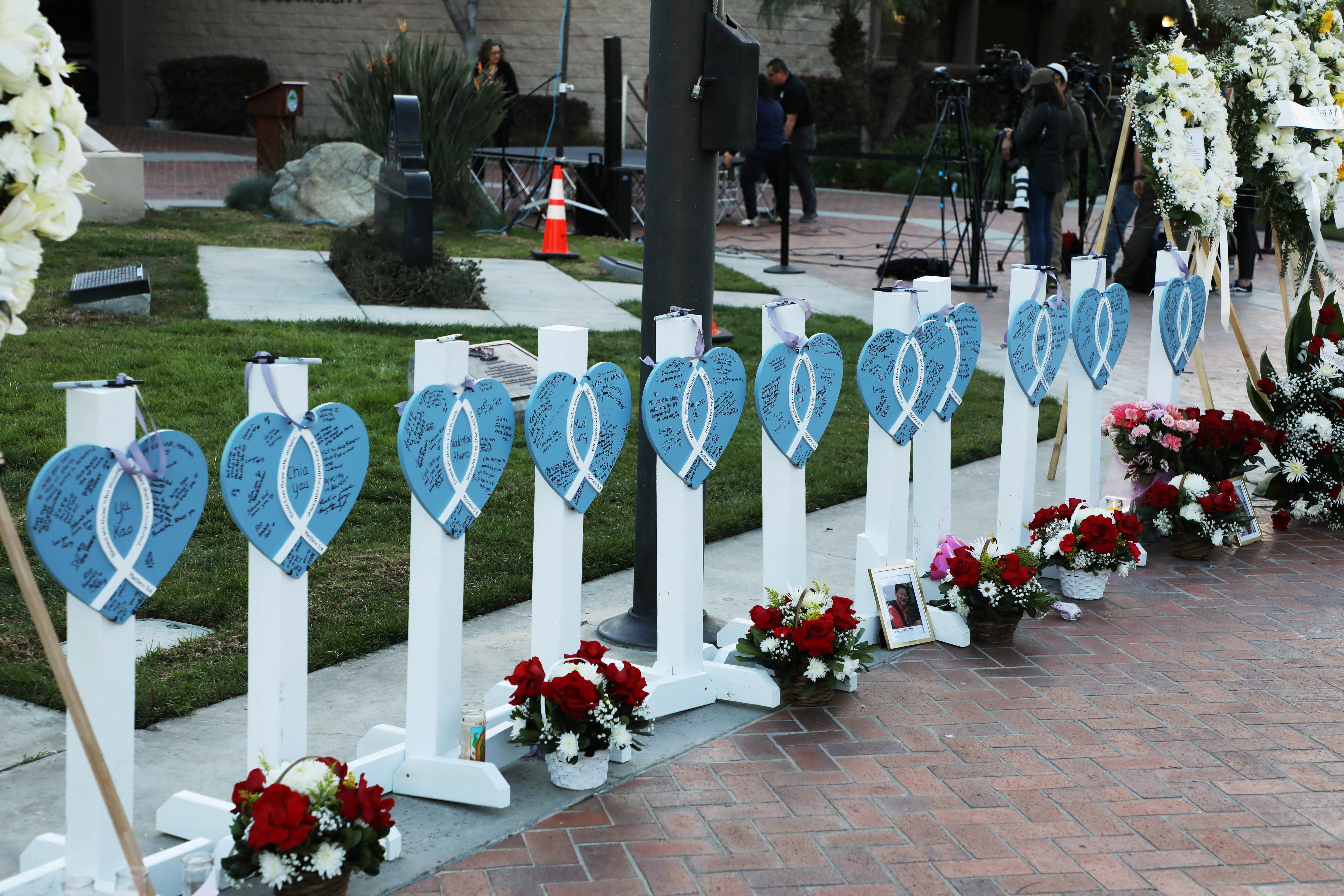 The names of the eleven people killed are written on hearts as people gather for a candlelight vigil after a mass shooting during Chinese Lunar New Year celebrations in Monterey Park, California, U.S. January 24, 2023. REUTERS/David Swanson
