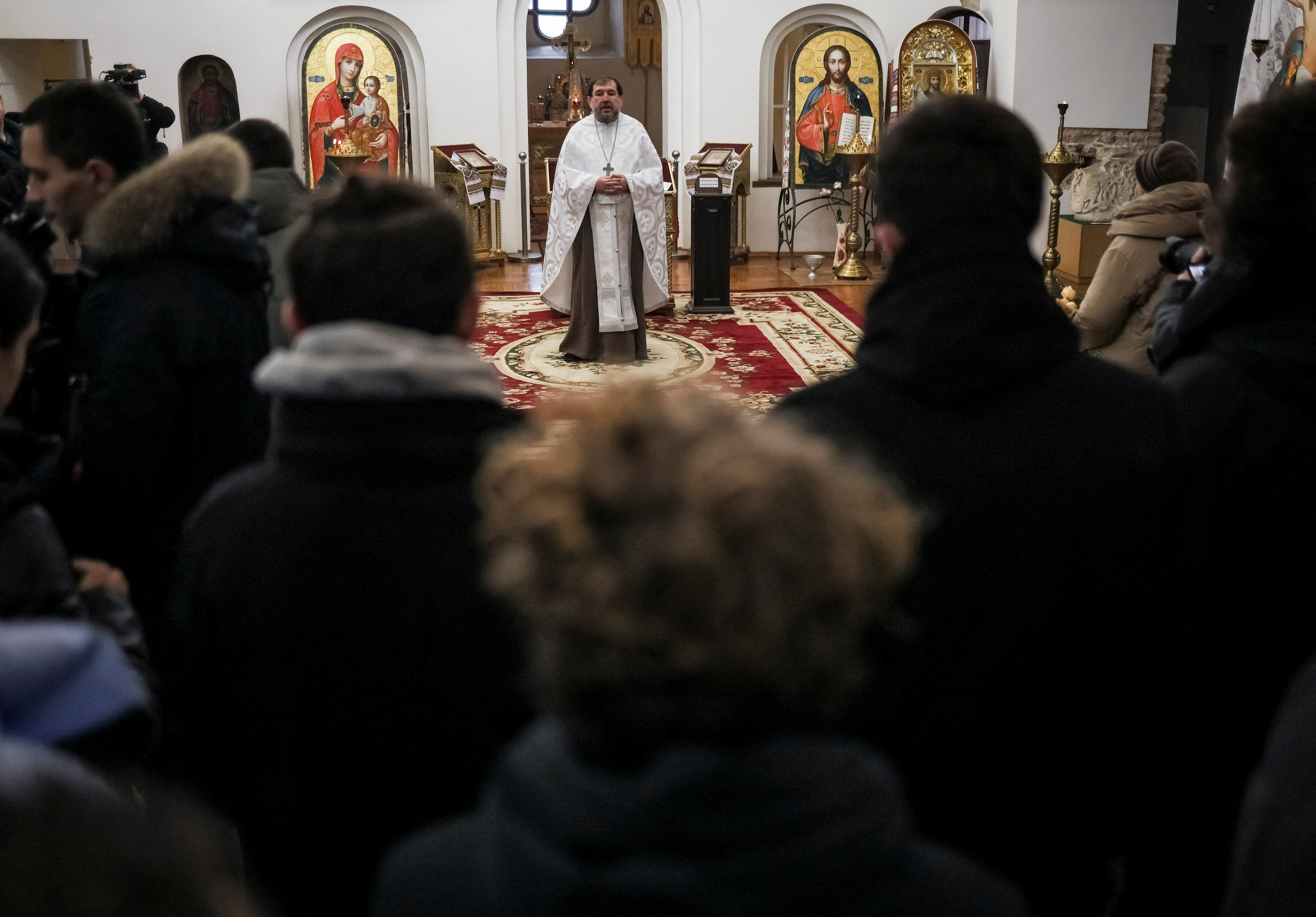 Volunteers and other mourners attend a memorial service for Andrew Bagshaw, one of the two British volunteers killed in eastern Ukraine while attempting a rescue from Soledar, amid Russia's attack on Ukraine, in Kyiv, Ukraine January 29, 2023. REUTERS/Gleb Garanich