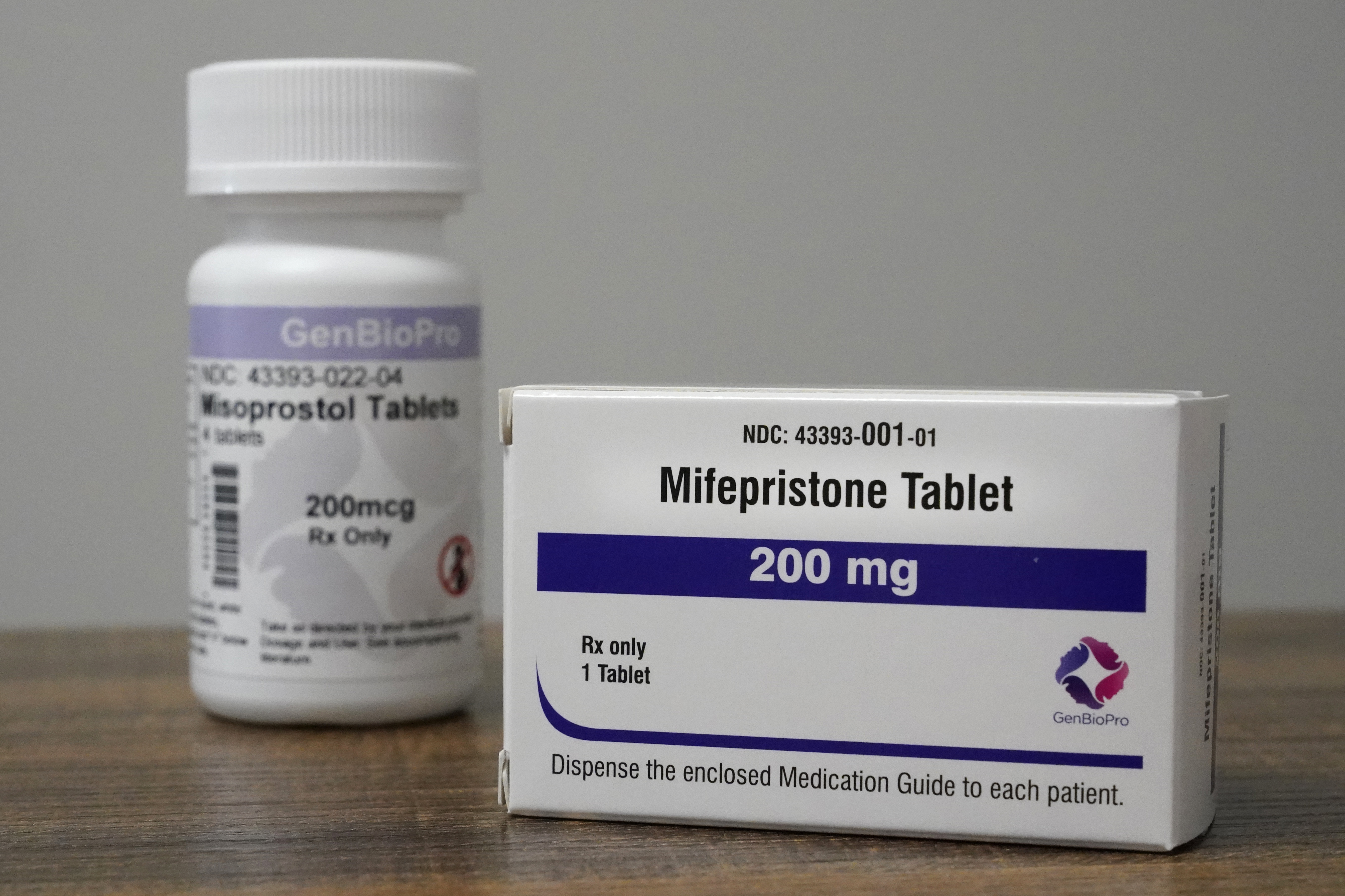 Containers of the medication used to end an early pregnancy sit on a table inside a Planned Parenthood clinic.