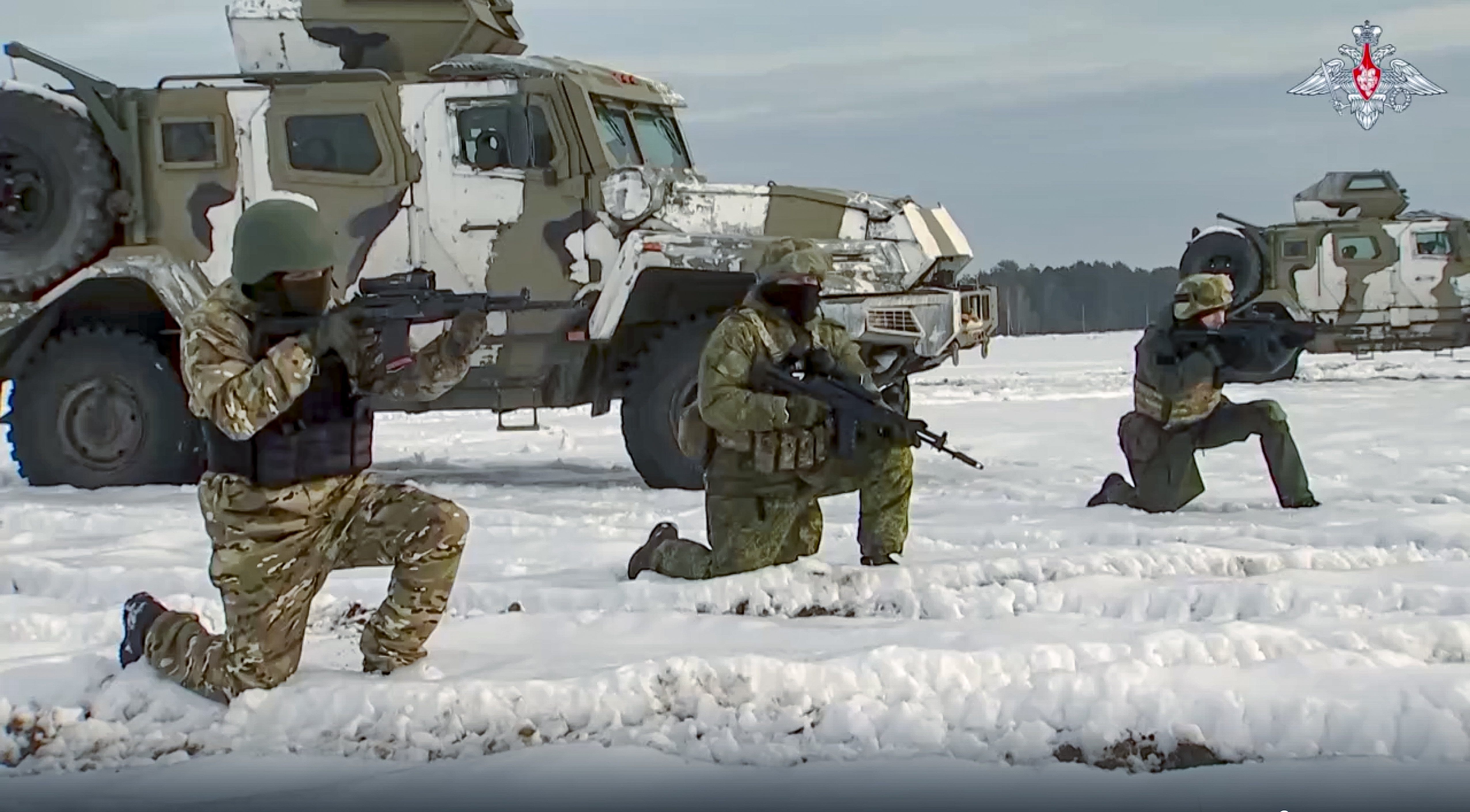 In this handout photo taken from video released by the Russian defence ministry on December 28, Russian troops take part in drills at an unspecified location in Belarus