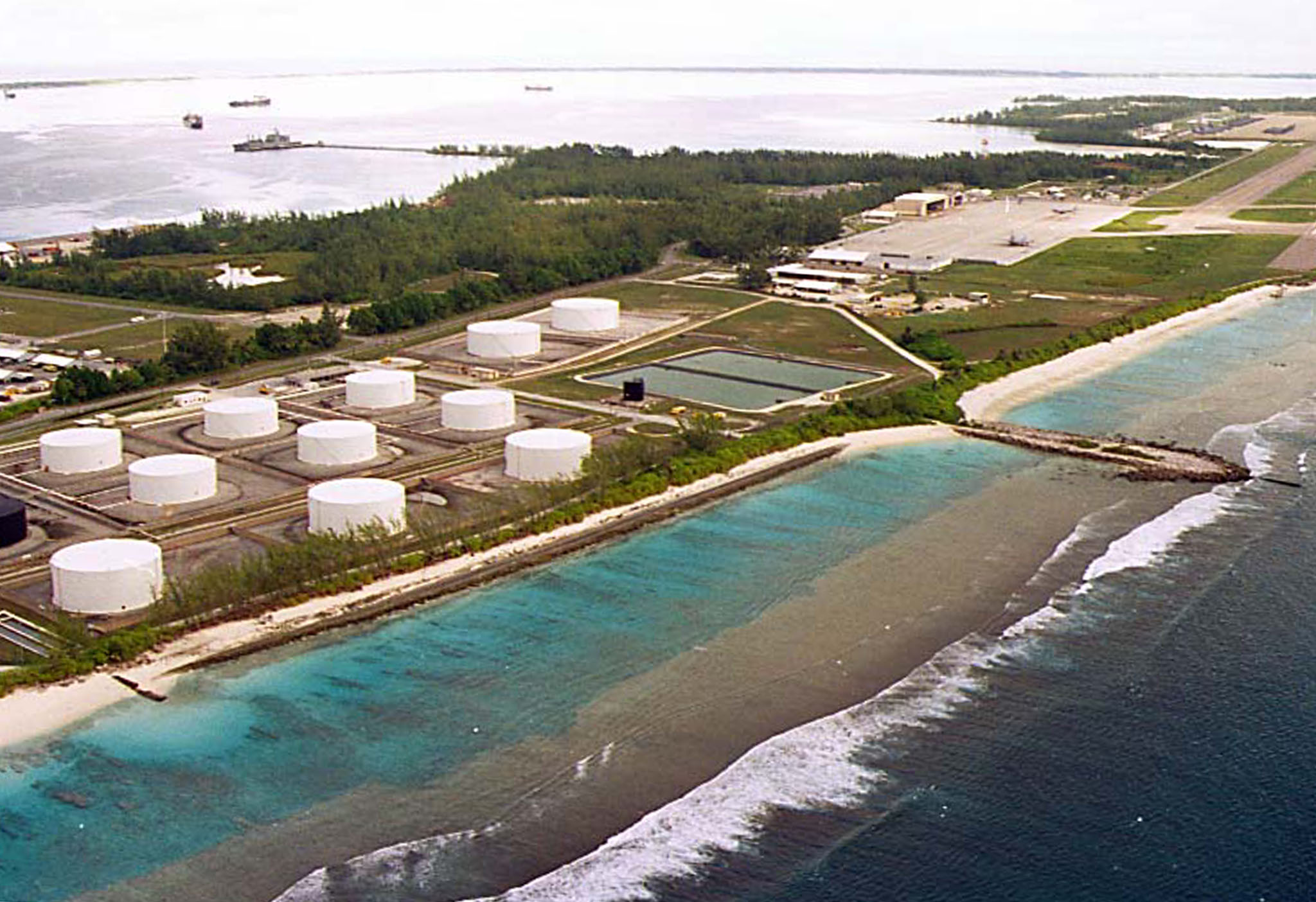 Fuel tanks at the edge of a military airstrip on Diego Garcia