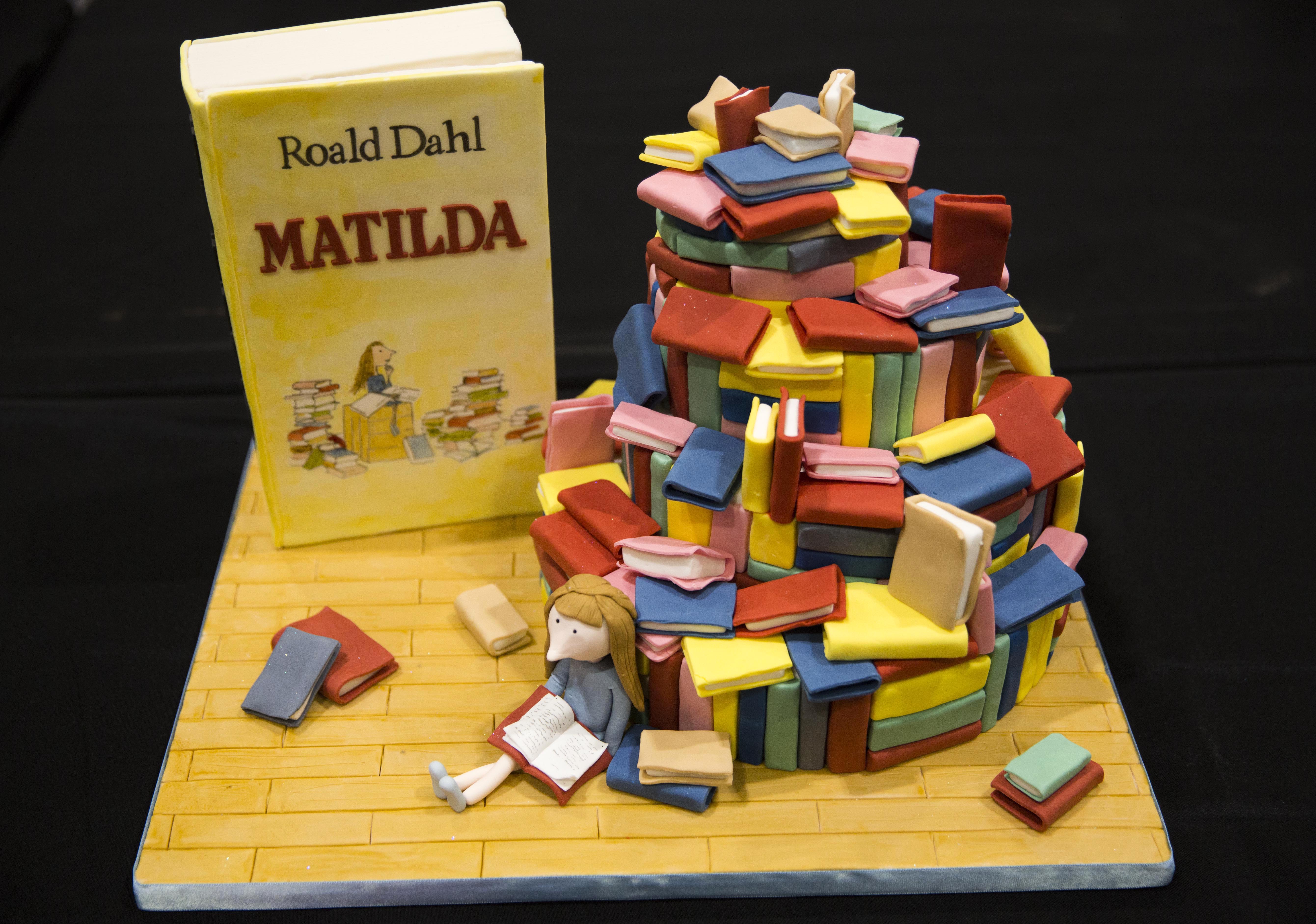 A cake decorated in the style of the Roald Dahl children's book "Matilda" is displayed at the Cake and Bake show in London, Britain October 3, 2015. REUTERS/Neil Hall