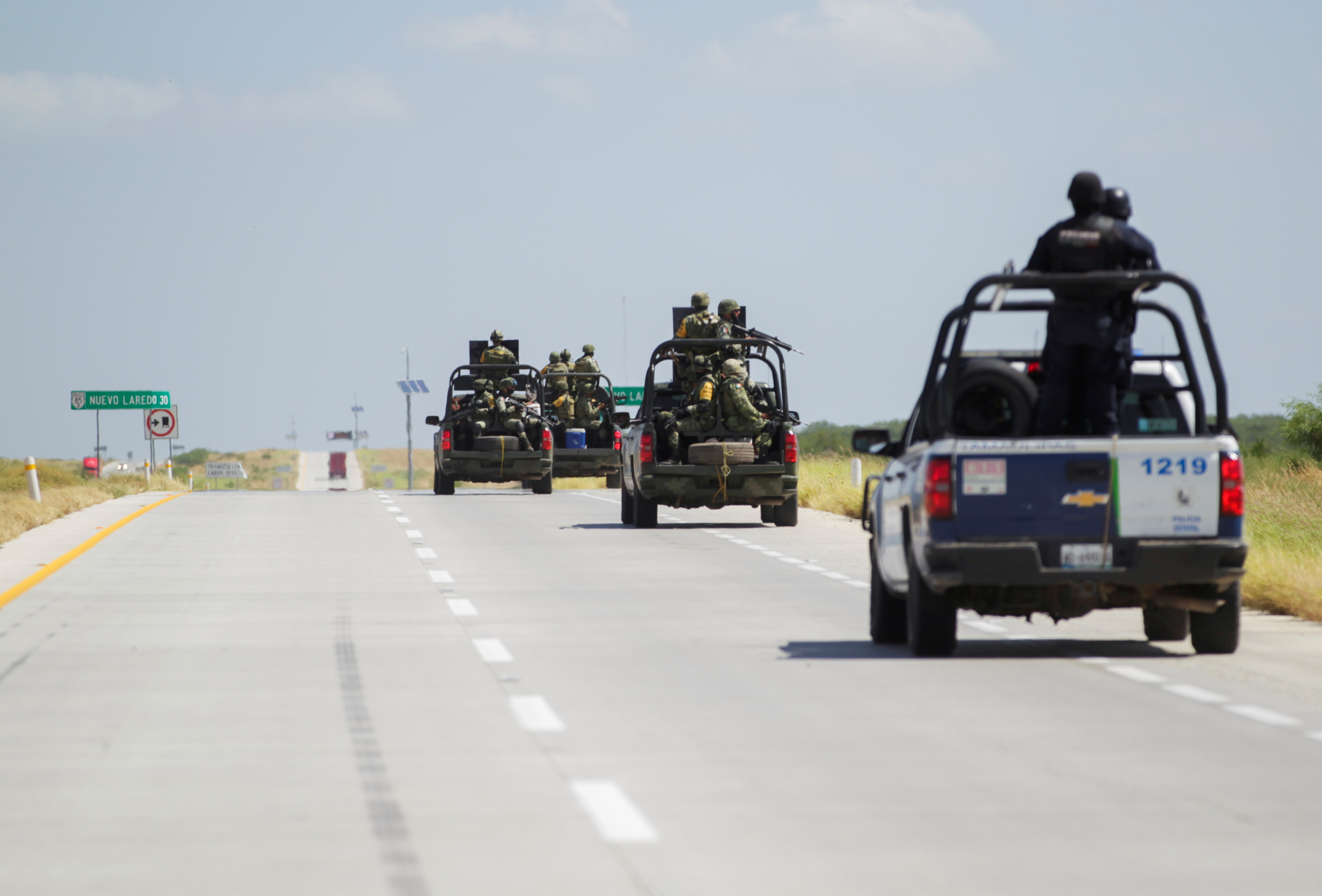 Security forces patrol a highway near Nuevo Laredo, Mexico, looking for missing people.