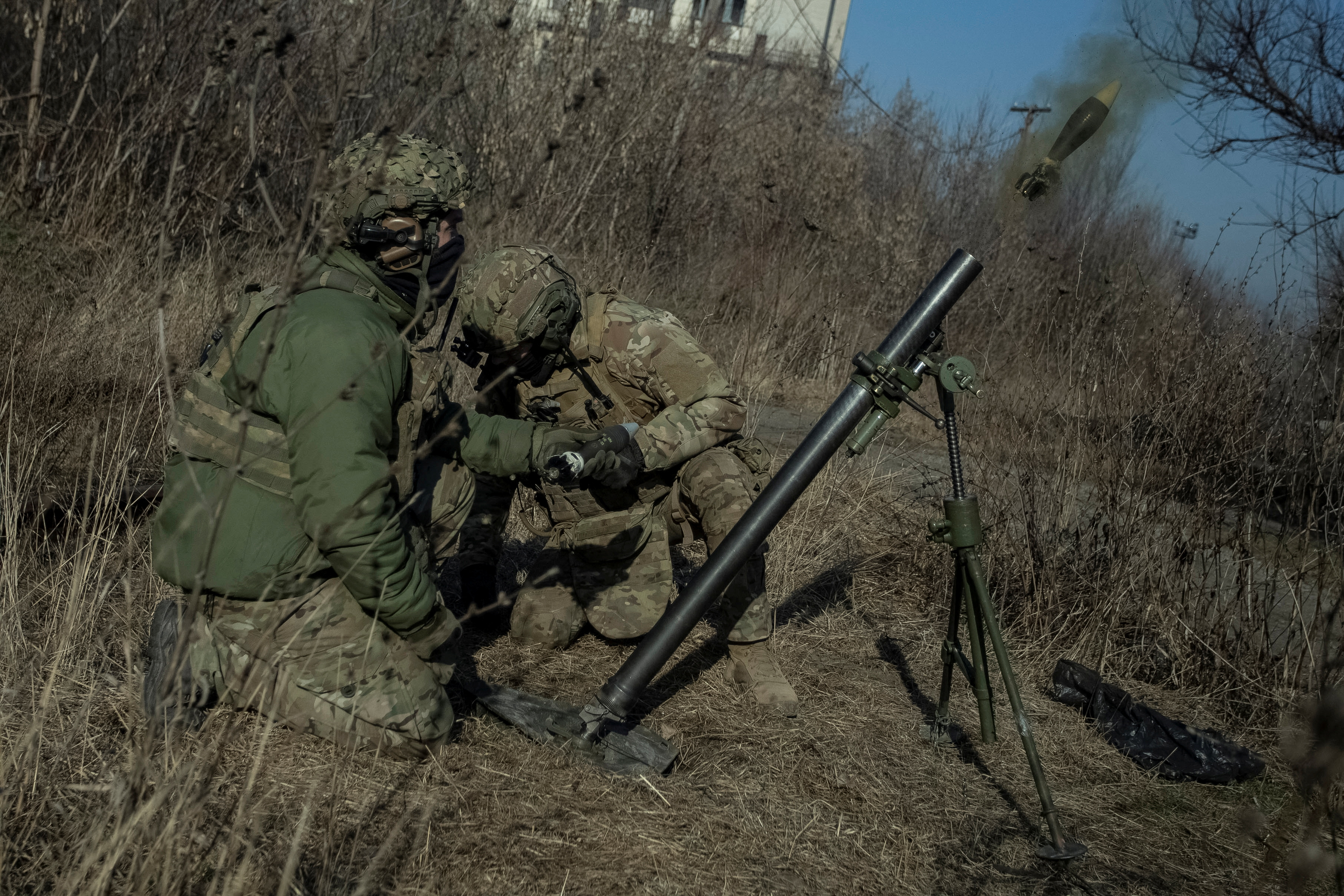 Ukrainian servicemen fire a mortar on a front line, as Russia's attack on Ukraine continues, in Bakhmut, Donetsk region, Ukraine January 27, 2023.