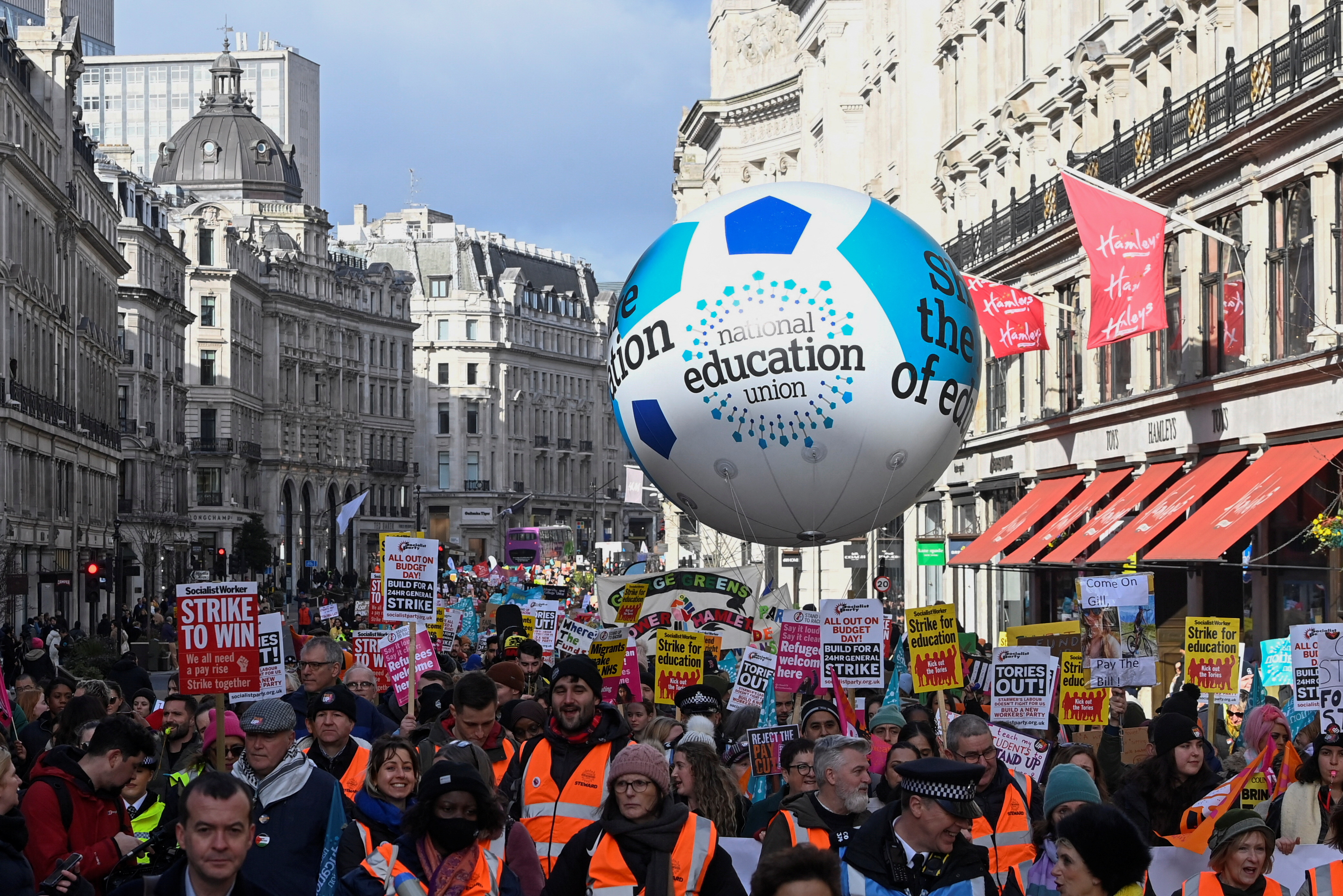 Striking workers attend a march, in London, Britain