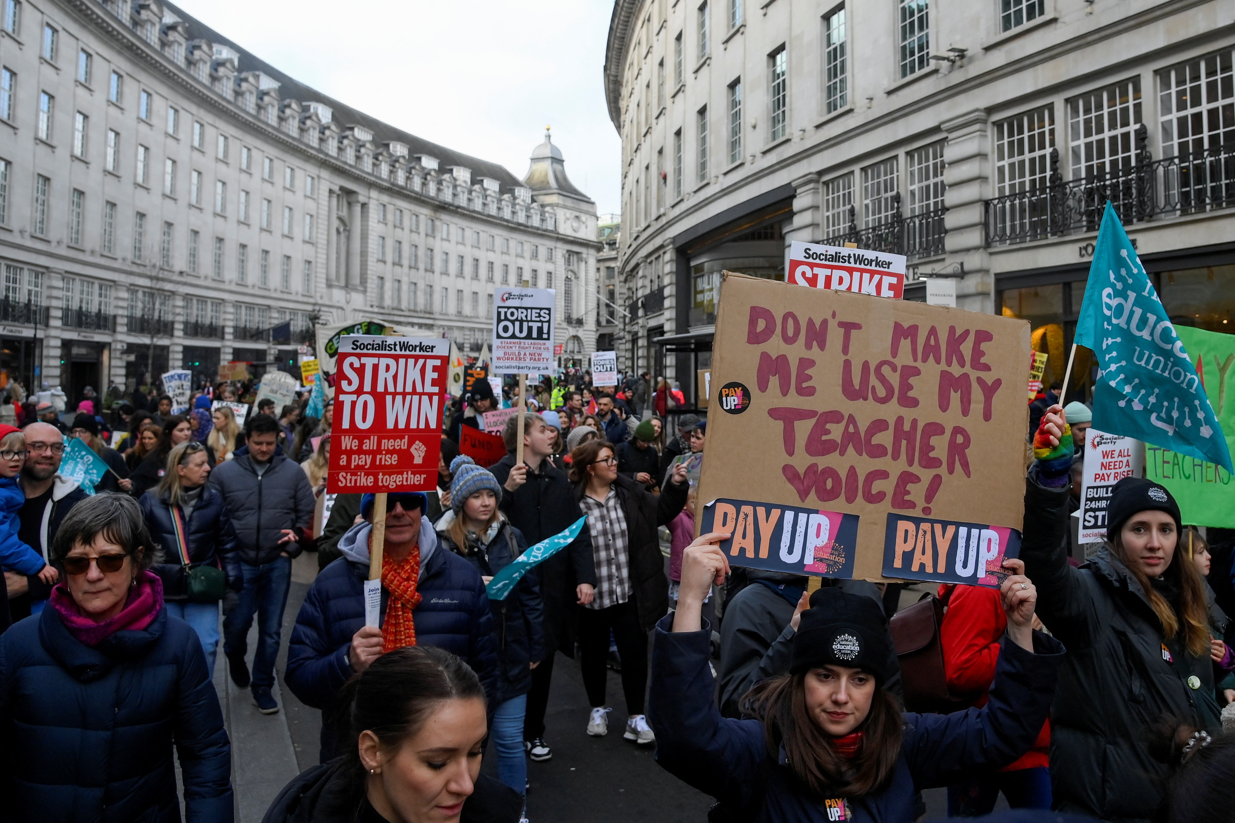 Striking workers attend a march, in London, Britain