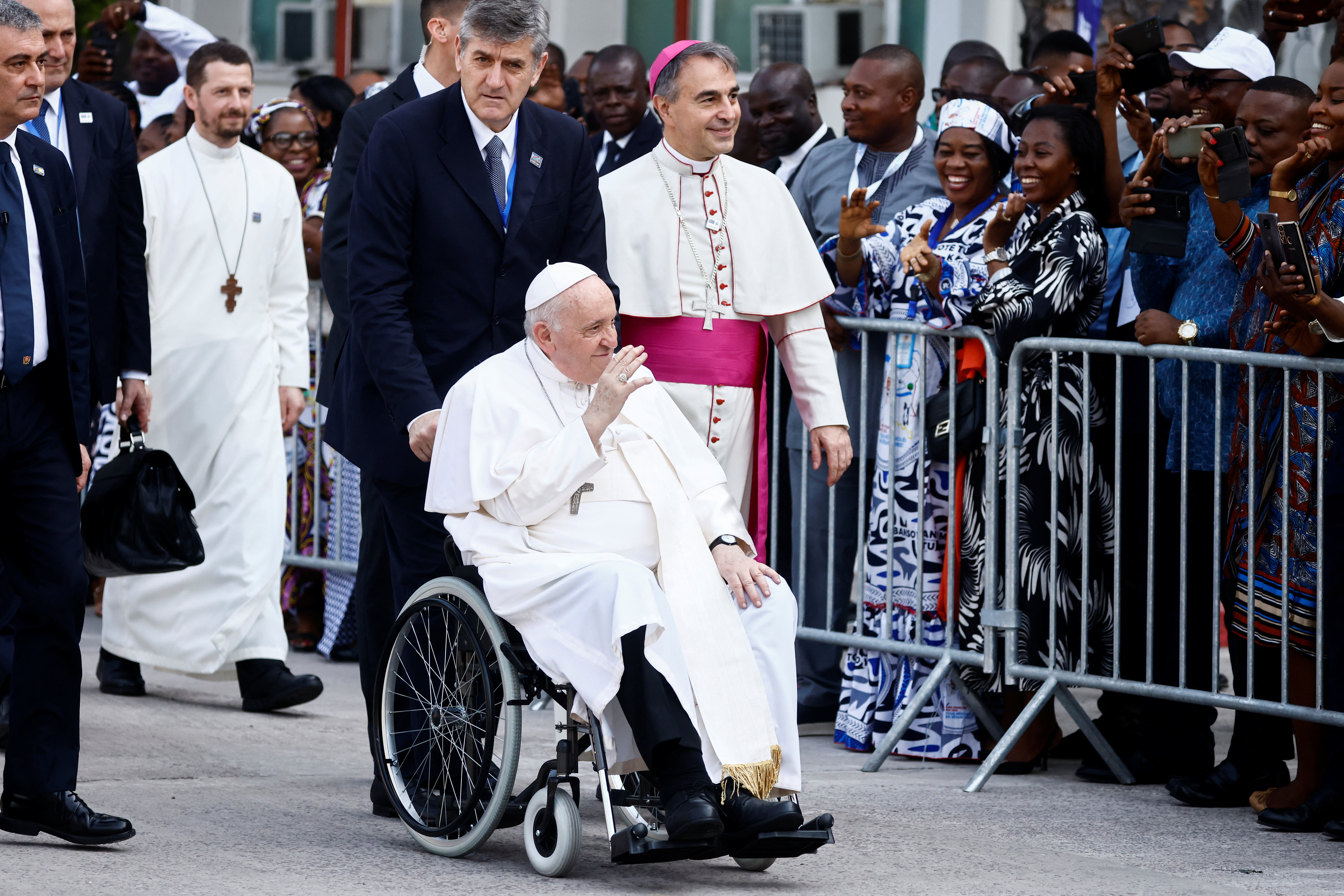 Pope Francis greets people before his meeting with Roman Catholic bishops at CENCO