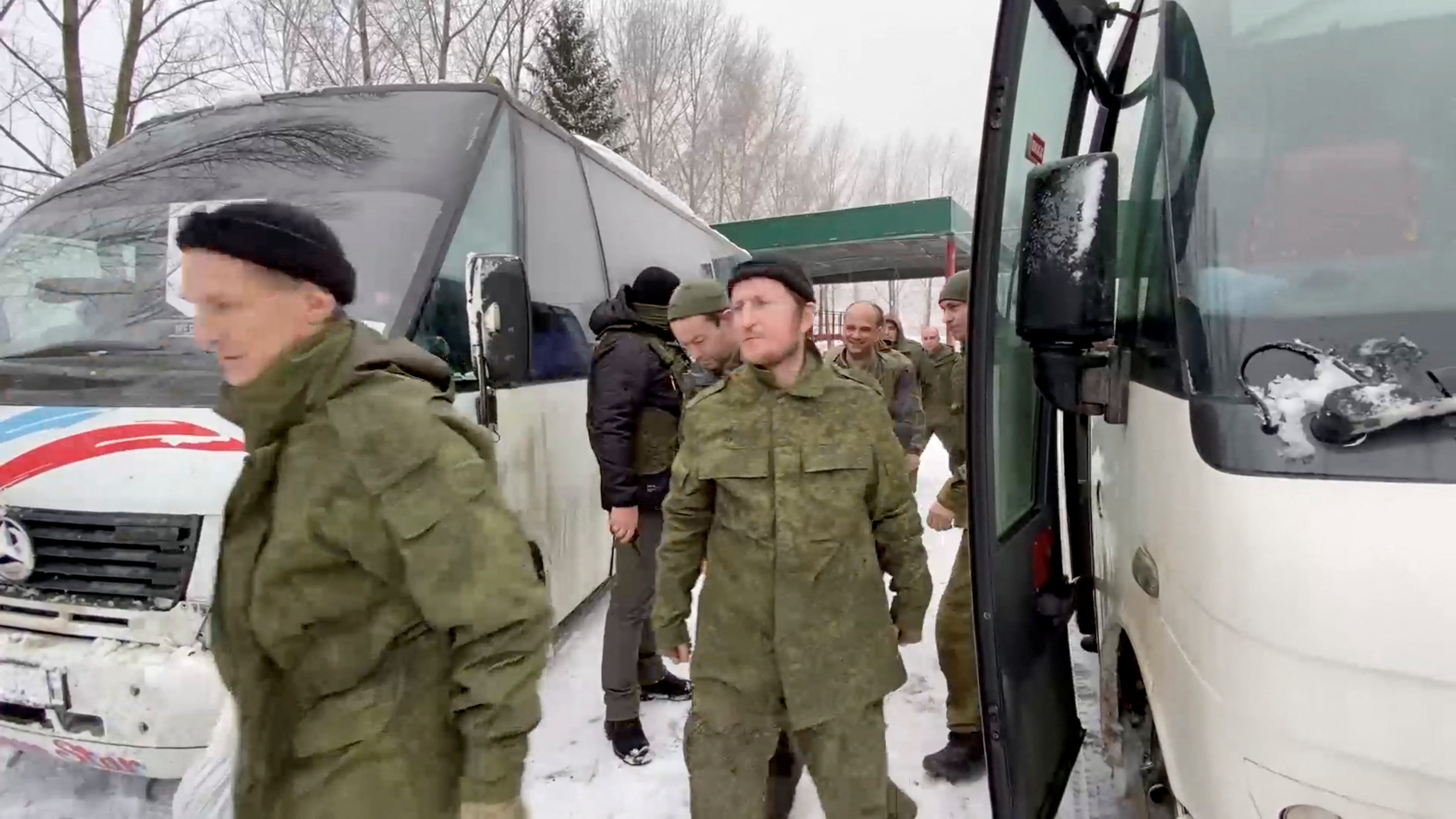 A still image from video, released by Russia's Defence Ministry, shows what it said to be captured Russian service personnel leaving a bus following the latest exchange of prisoners of war at an unknown location in the course of Russia-Ukraine conflict, in this image taken from handout footage released February 4, 2023. Russian Defence Ministry/Handout via REUTERS ATTENTION EDITORS - THIS IMAGE WAS PROVIDED BY A THIRD PARTY. NO RESALES. NO ARCHIVES. MANDATORY CREDIT.
