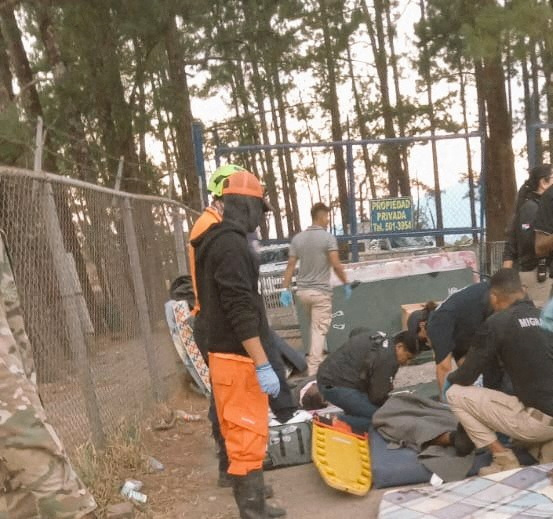 Workers assist those injured in the bus accident