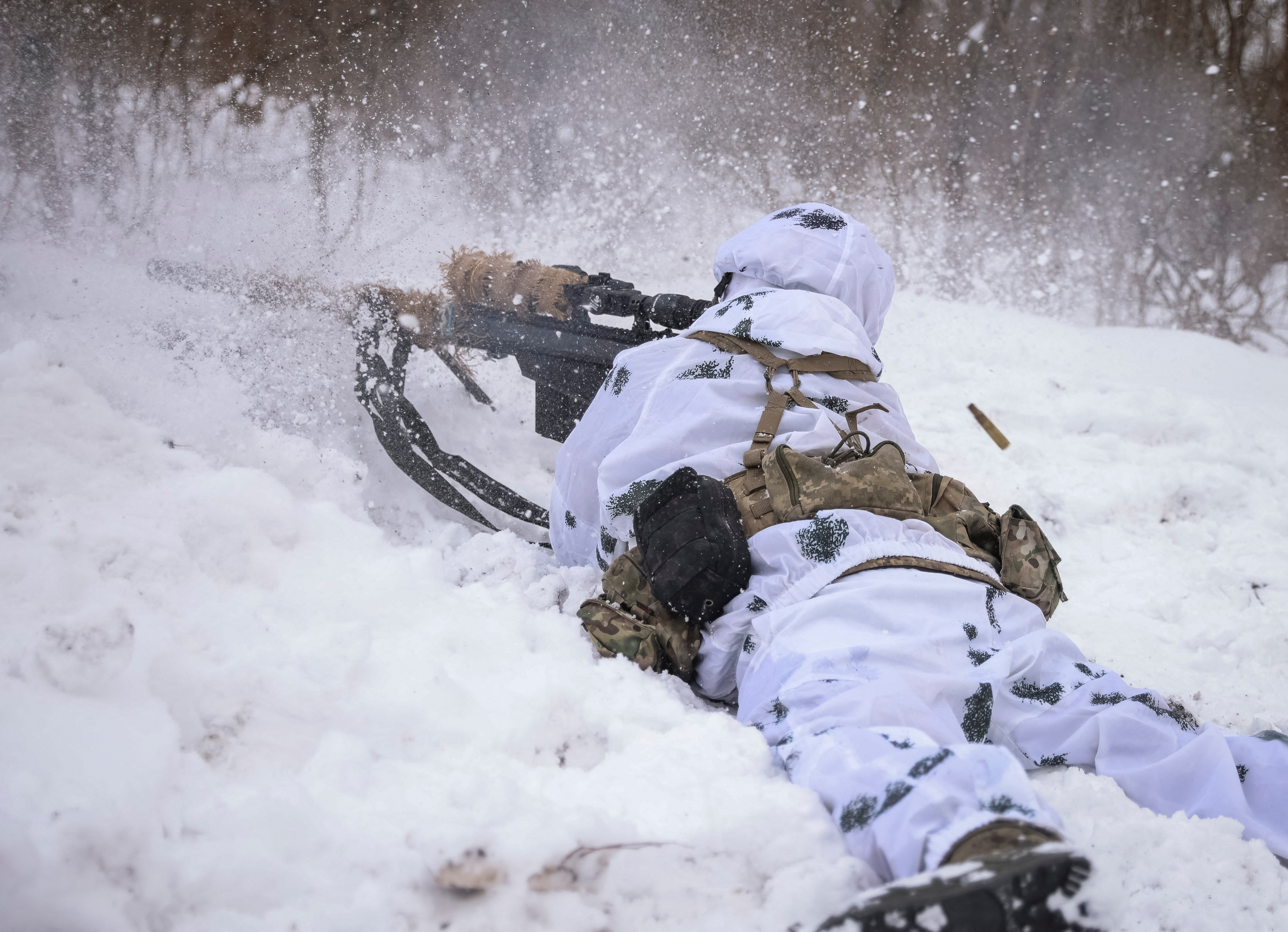 A Ukrainian sniper fires from his position, as Russia's attack on Ukraine continues, in the front line city of Bakhmut, Ukraine February 17, 2023. REUTERS/Yevhen Titov