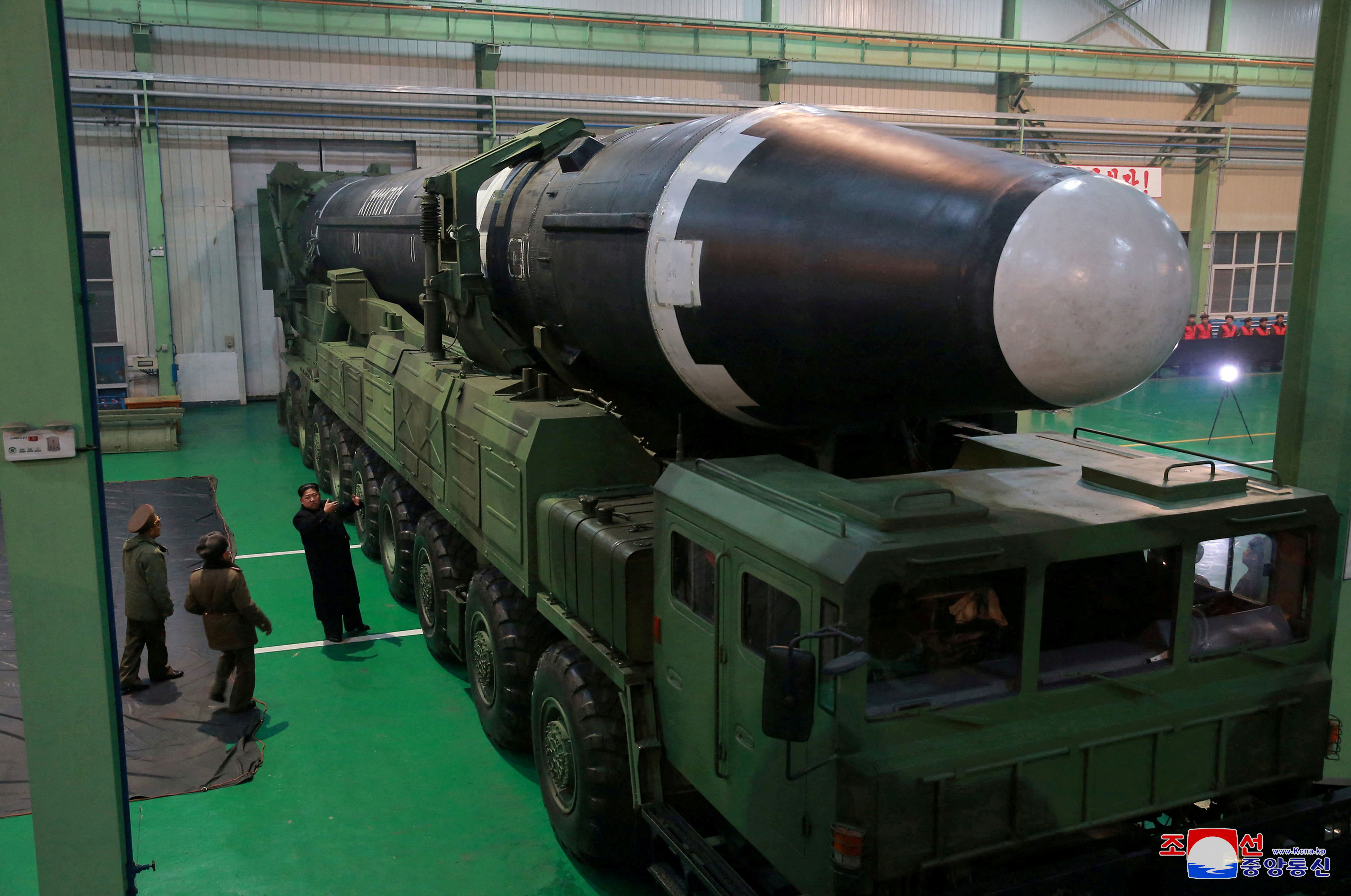 North Korea's leader Kim Jong Un is seen with a Hwasong-15 missile.