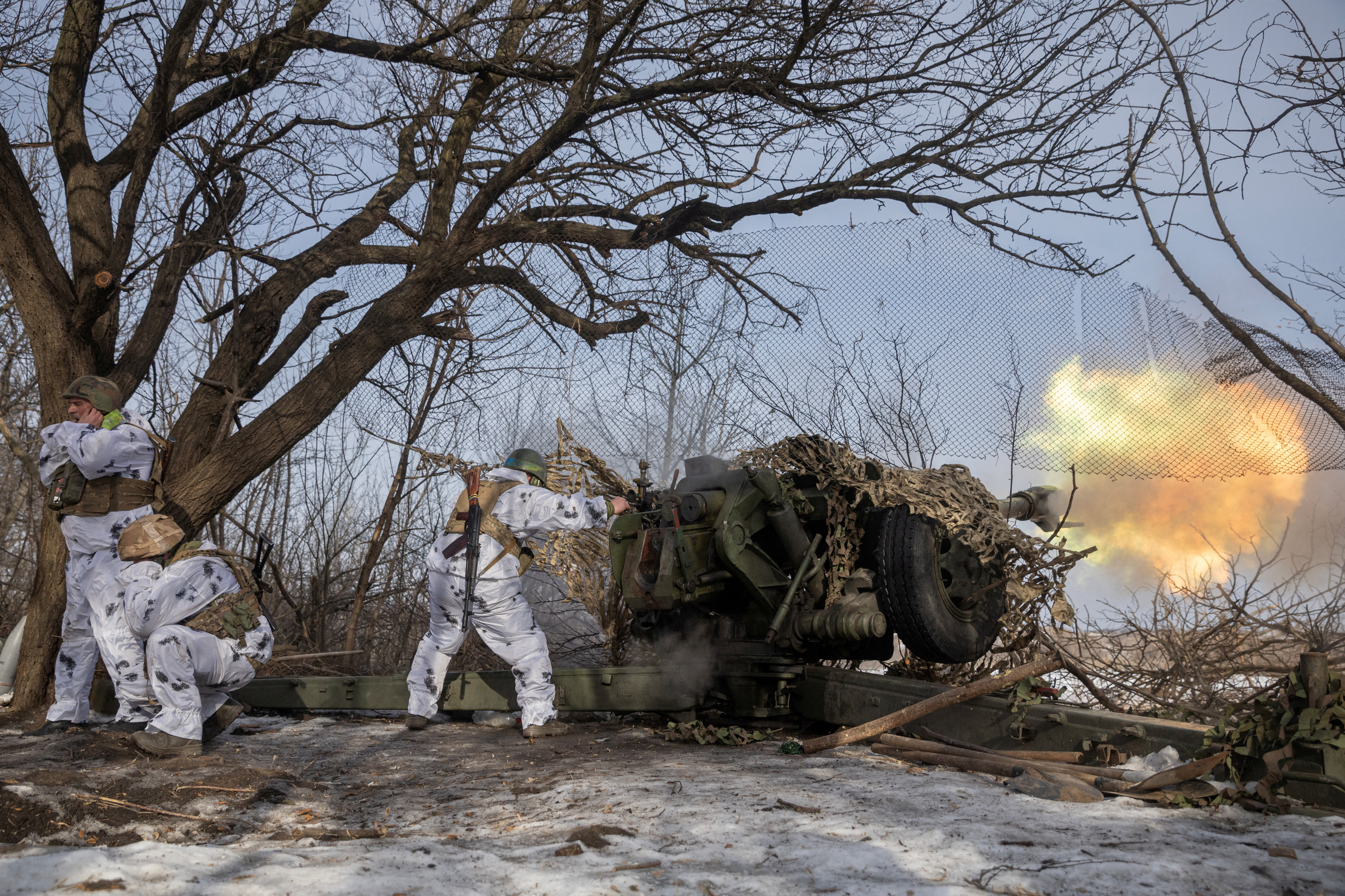 Ukrainian servicemen of the 80th Independent Air Assault Brigade fire a Howitzer D-30 artillery weapon towards Russian troops, as Russia's attack on Ukraine continues, near the frontline town of Bakhmut, Donetsk region, Ukraine February 24, 2023.