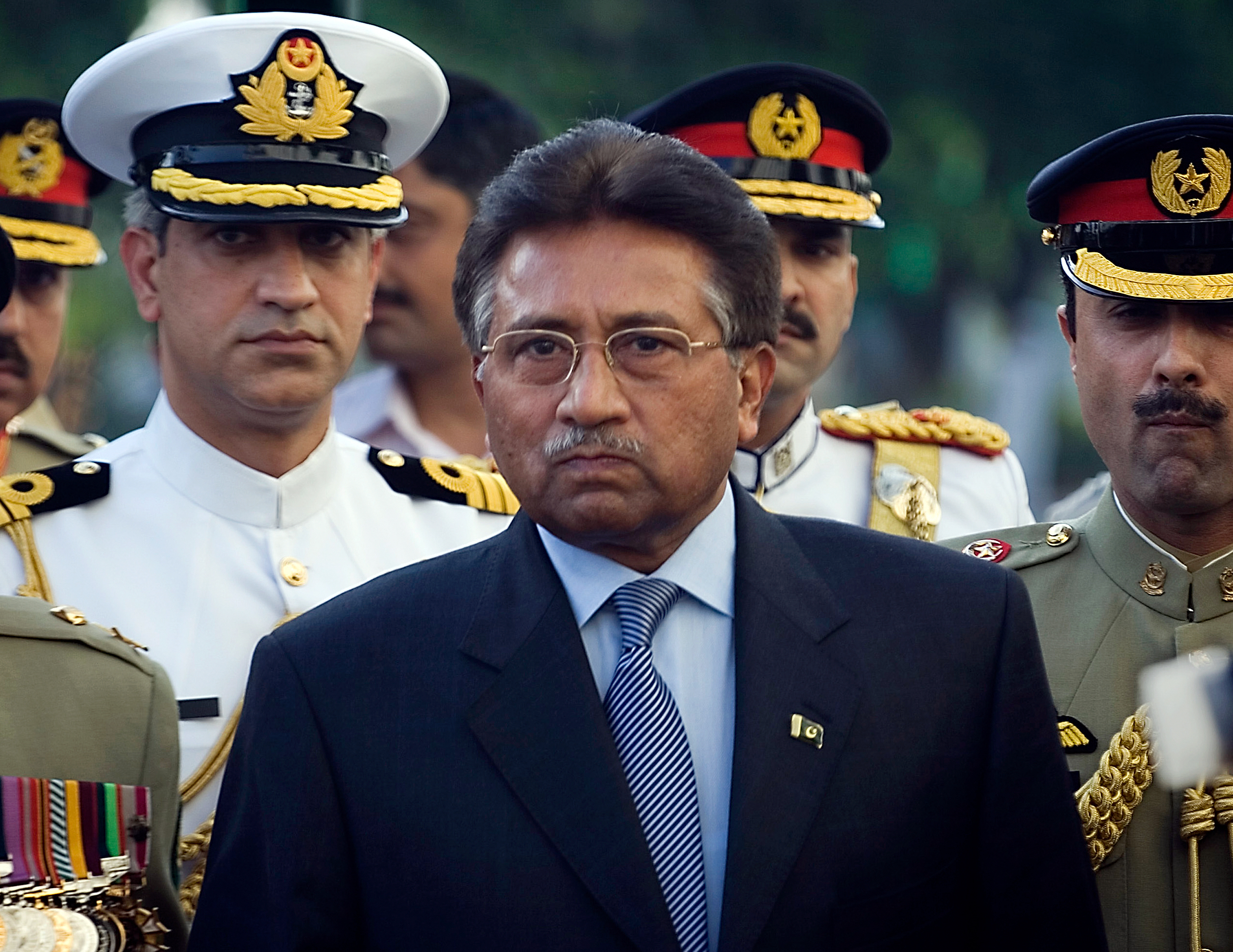 Outgoing President Pervez Musharraf is surrounded by top military officers as he leaves the Presidential House in Islamabad, Pakistan