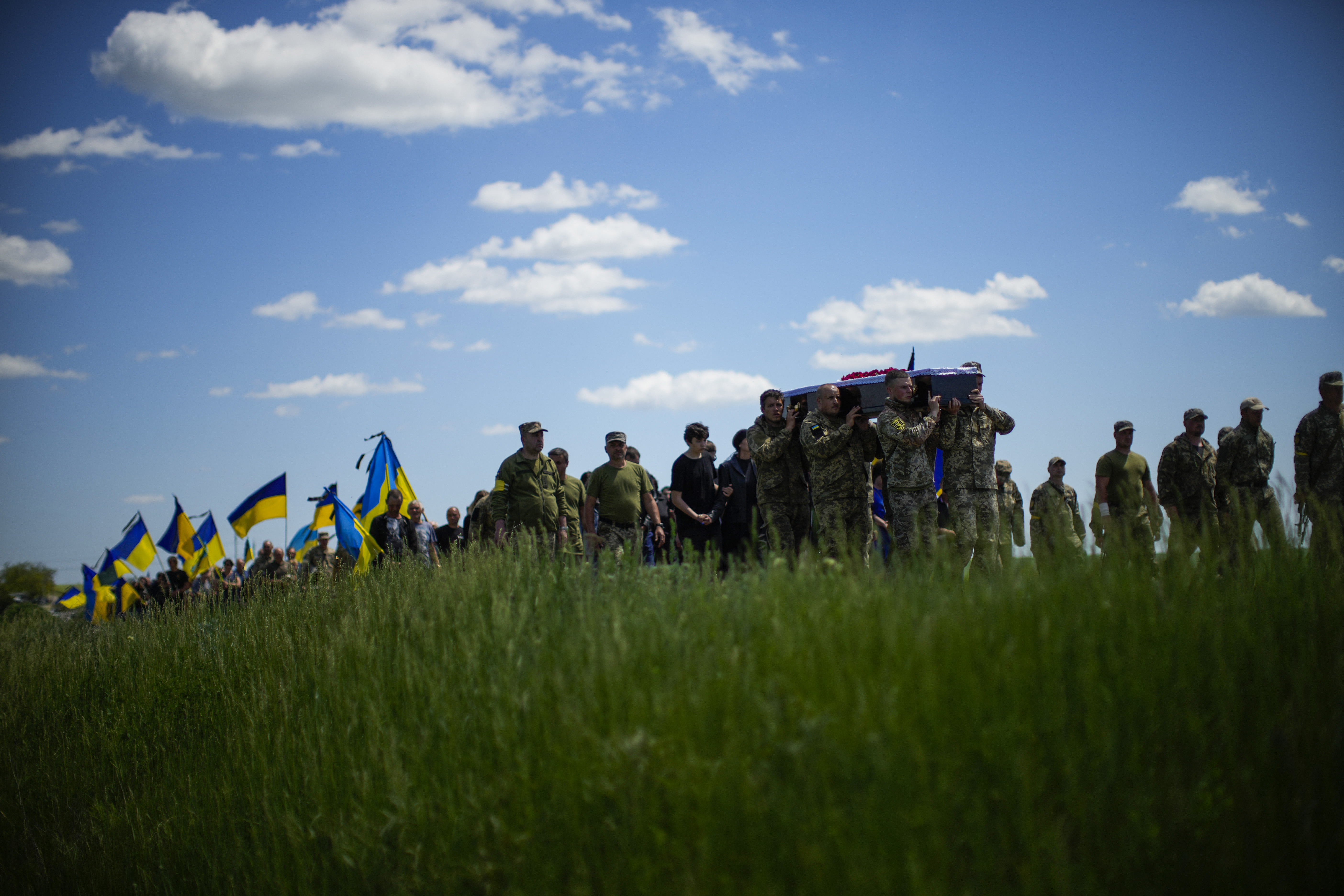 Ukrainian soldiers carry the coffin of Volodymyr Losev, 38, during his funeral in Zorya Truda in the Odesa region of Ukraine