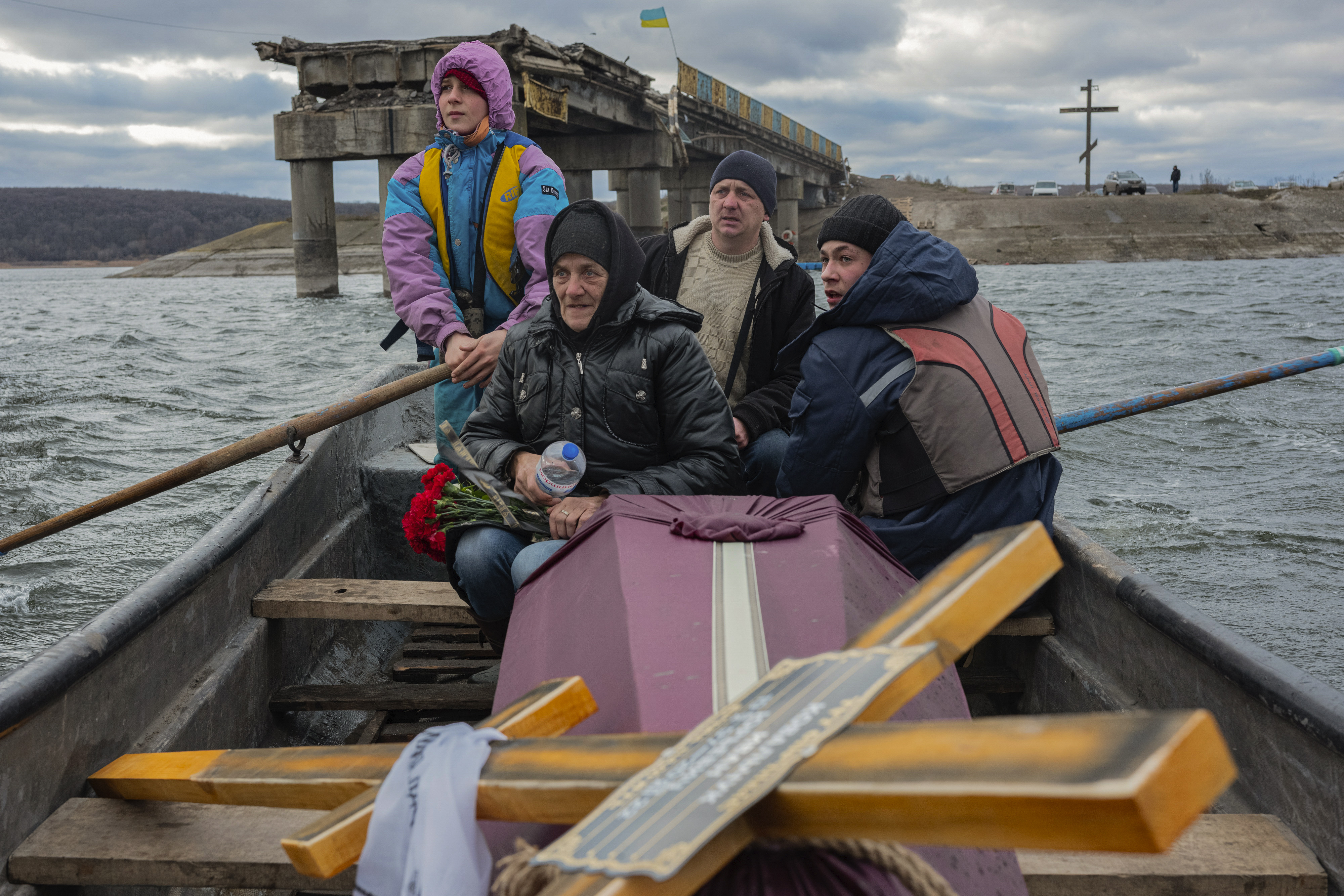 A woman transporting the coffin holding the body of her son, a soldier who was killed in fighting with Russians