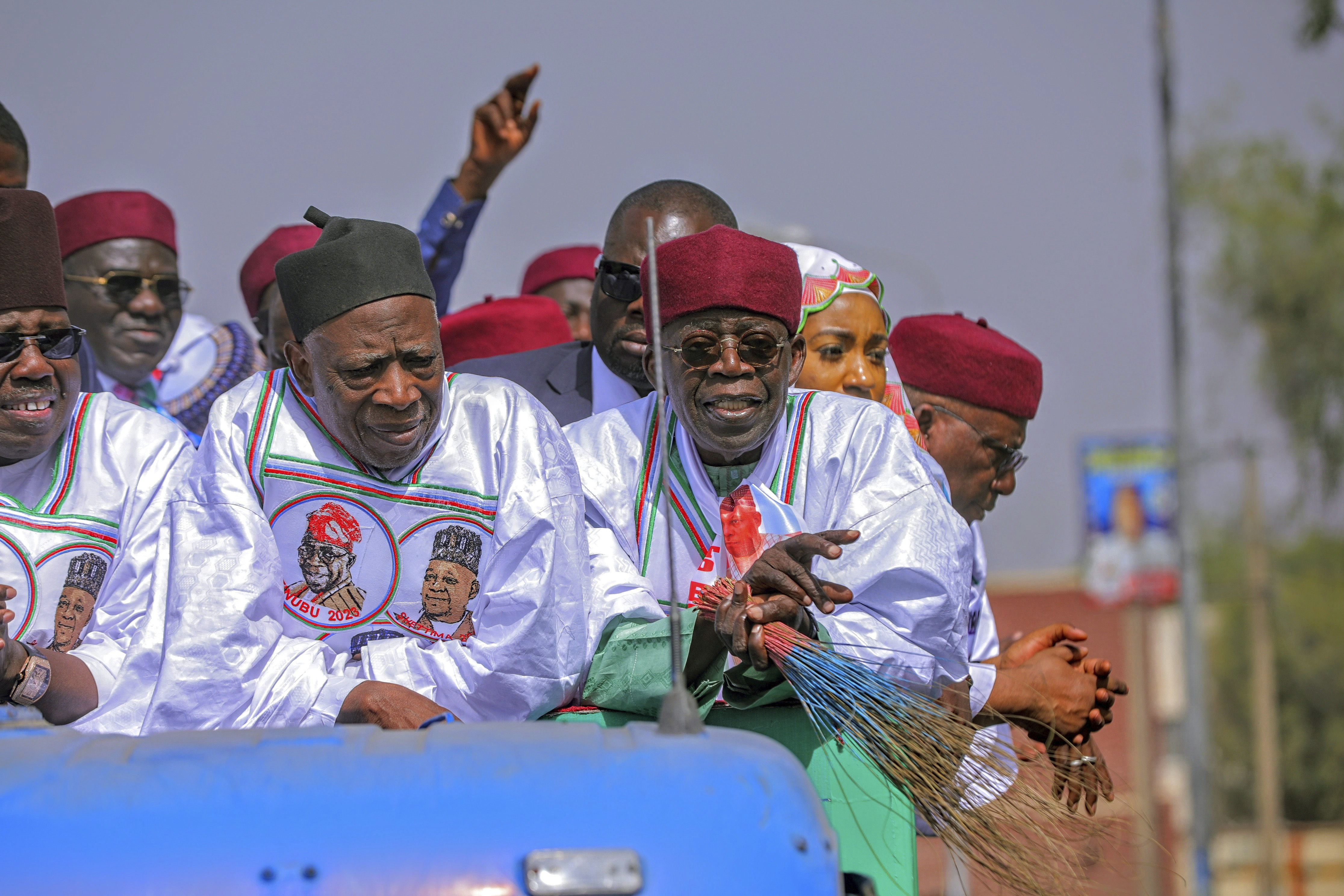 Bola Ahmed Tinubu, foreground right, is a frontrunner going into Nigeria's presidential election, representing the ruling All Progressives Congress [Joshua Olatunji/AP]