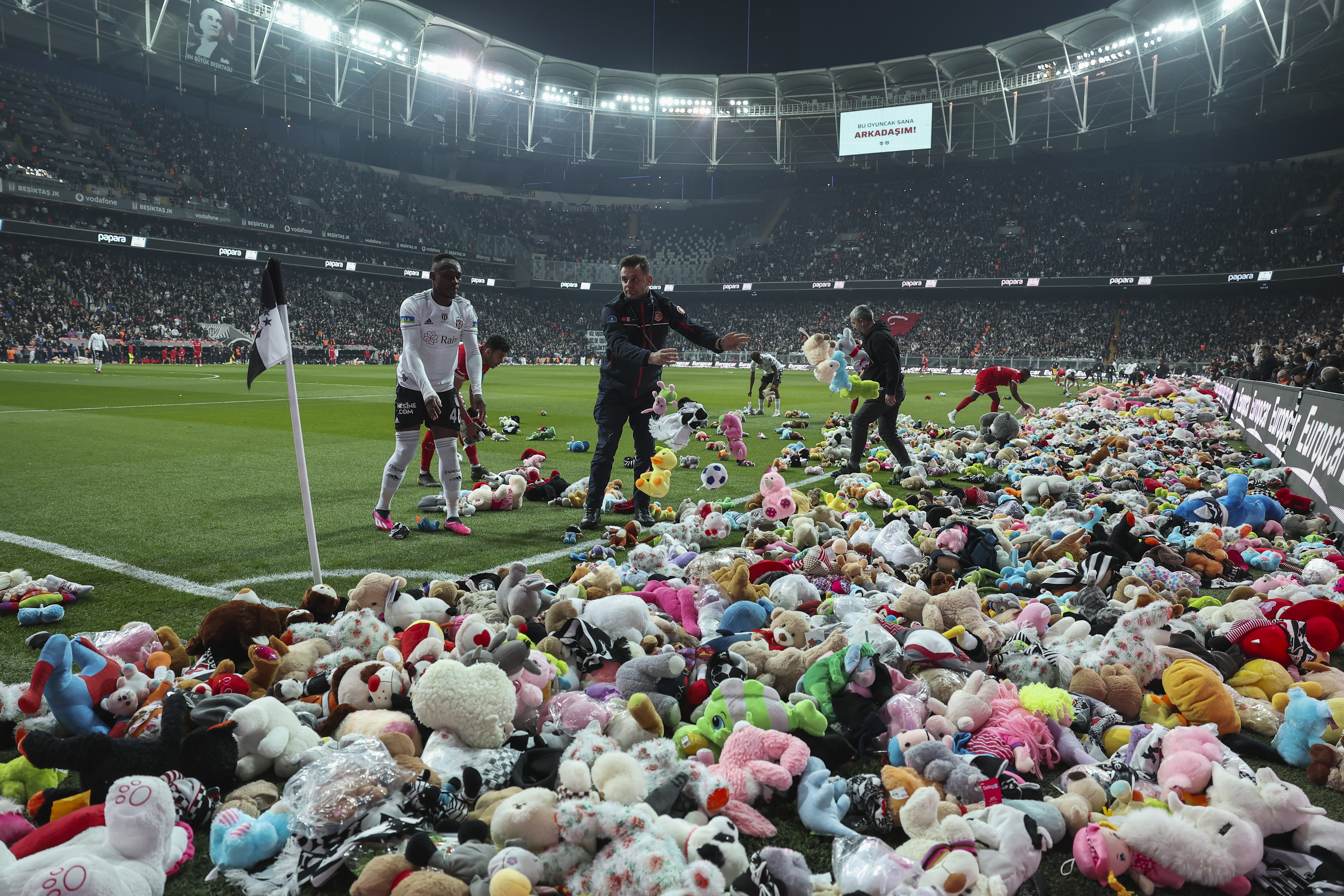 Fans throw toys onto the pitch during the Turkish Super League football match