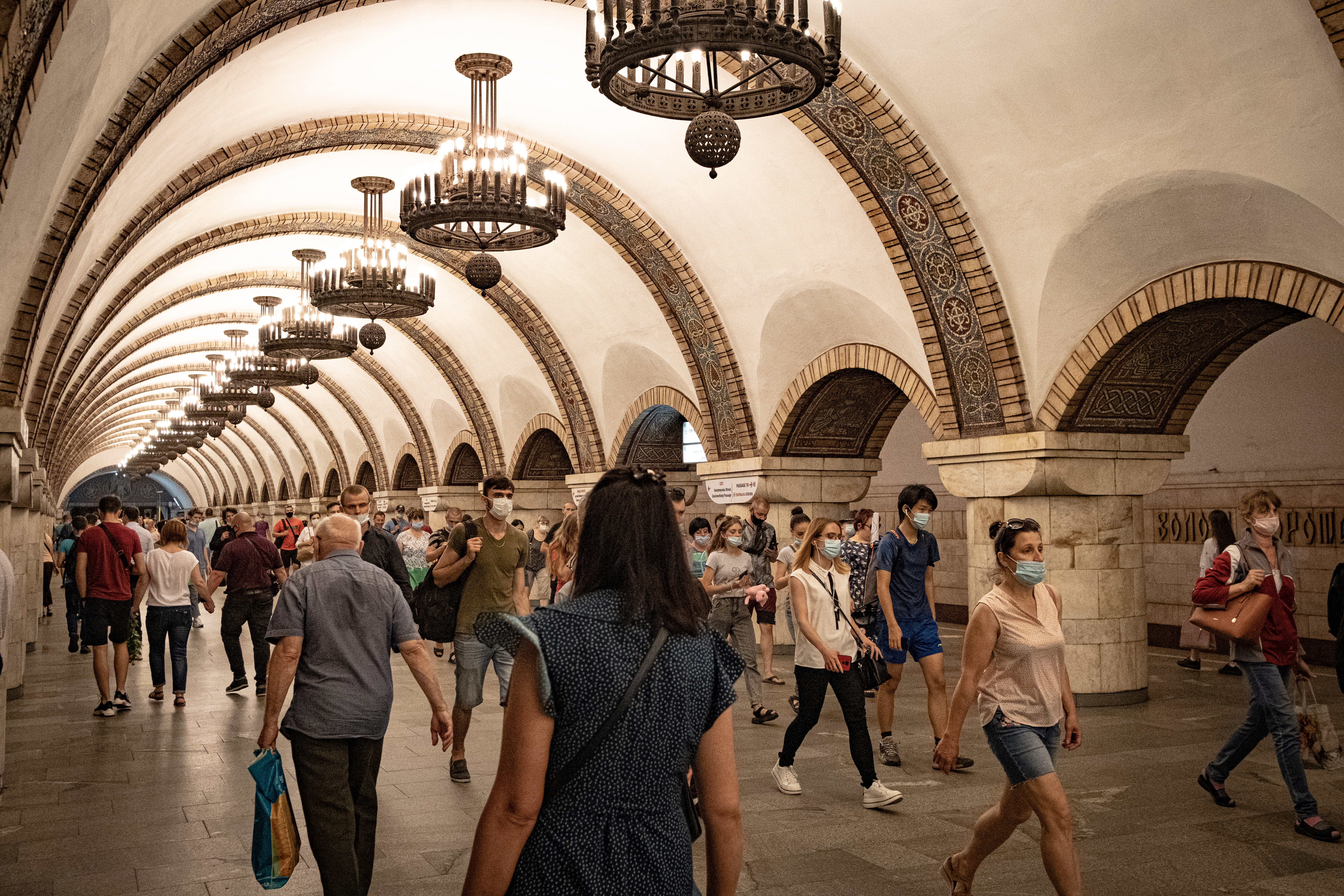 A photo of people walking through Arsenalna station in Kyiv.